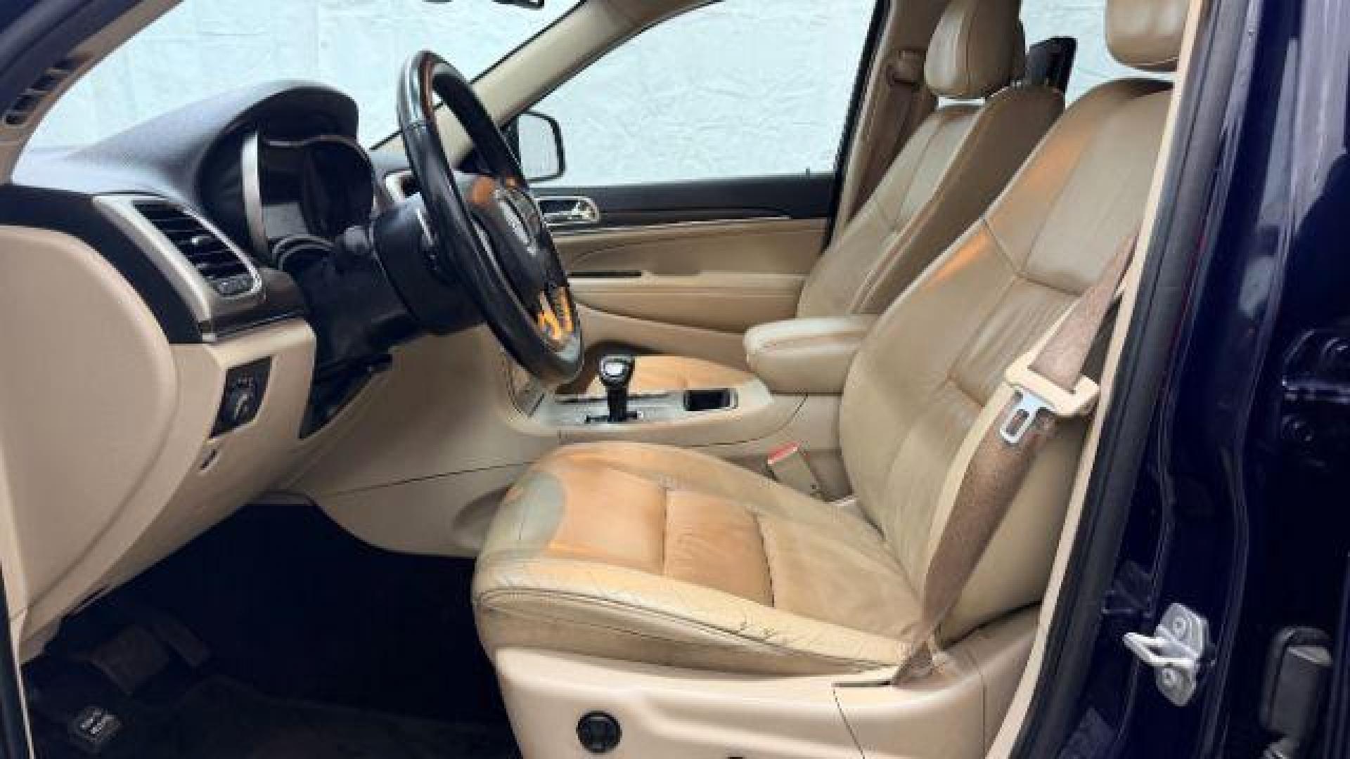 2015 Blue Jeep Grand Cherokee Limited (1C4RJEBG4FC) with an 3.6L V-6 DOHC engine, located at 1806 Veterans Memorial Hwy SW, Austell, GA, 30168, (770) 944-9558, 33.817959, -84.606987 - Photo#11