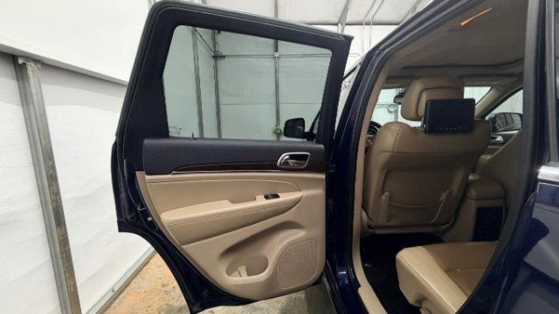 2015 Blue Jeep Grand Cherokee Limited (1C4RJEBG4FC) with an 3.6L V-6 DOHC engine, located at 1806 Veterans Memorial Hwy SW, Austell, GA, 30168, (770) 944-9558, 33.817959, -84.606987 - Photo#13