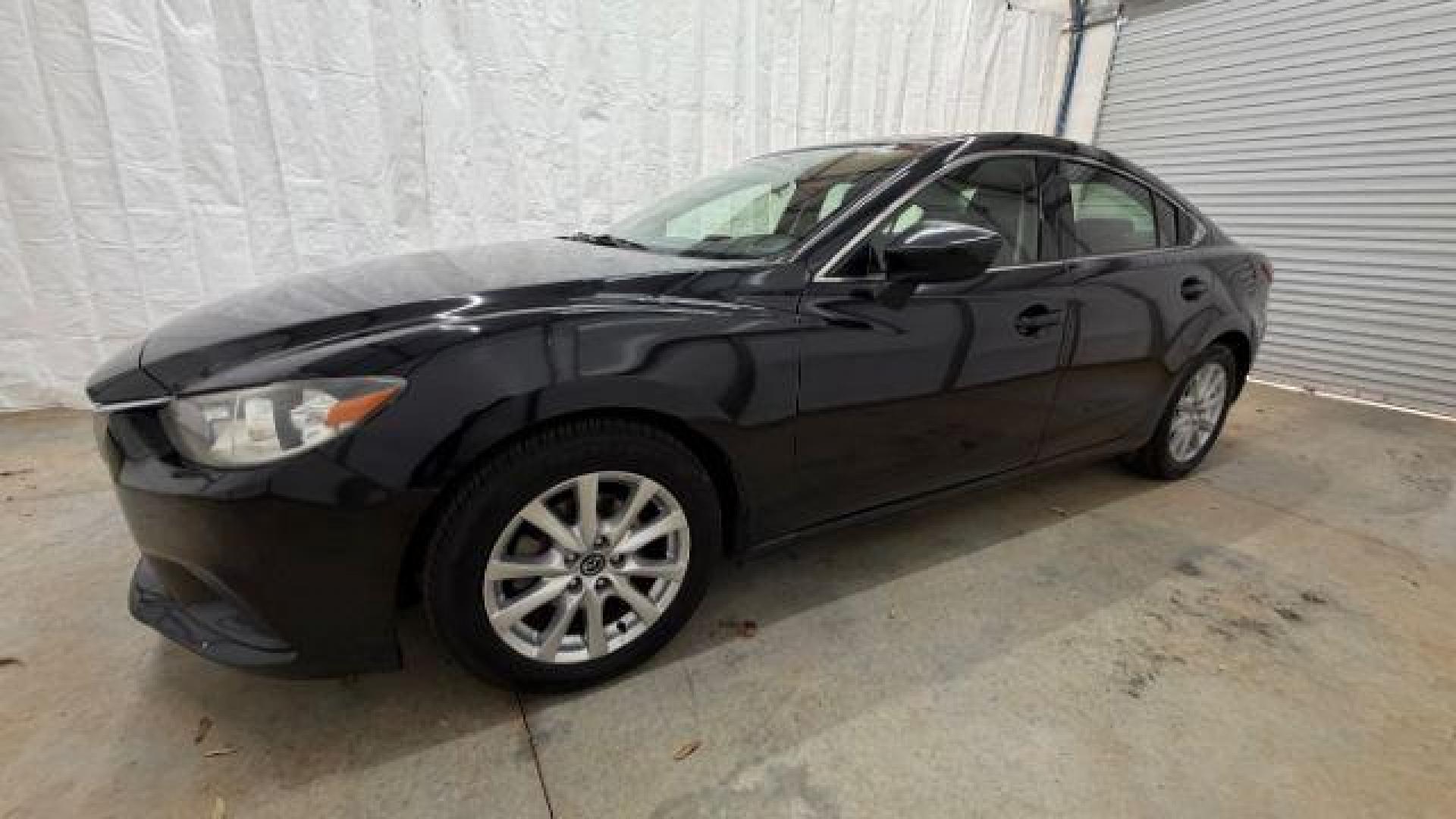 2016 Black Mazda Mazda6 i Sport (JM1GJ1U57G1) with an SKYACTIV-G 2.5L I-4 gasoline direct injection engine, located at 1806 Veterans Memorial Hwy SW, Austell, GA, 30168, (770) 944-9558, 33.817959, -84.606987 - Photo#1