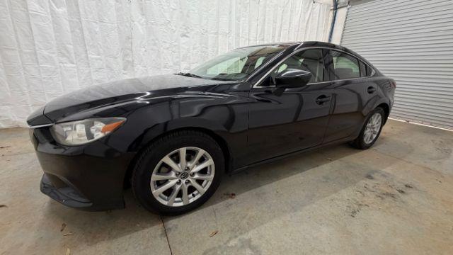 2016 Black Mazda Mazda6 i Sport (JM1GJ1U57G1) with an SKYACTIV-G 2.5L I-4 gasoline direct injection engine, located at 1806 Veterans Memorial Hwy SW, Austell, GA, 30168, (770) 944-9558, 33.817959, -84.606987 - Photo#1