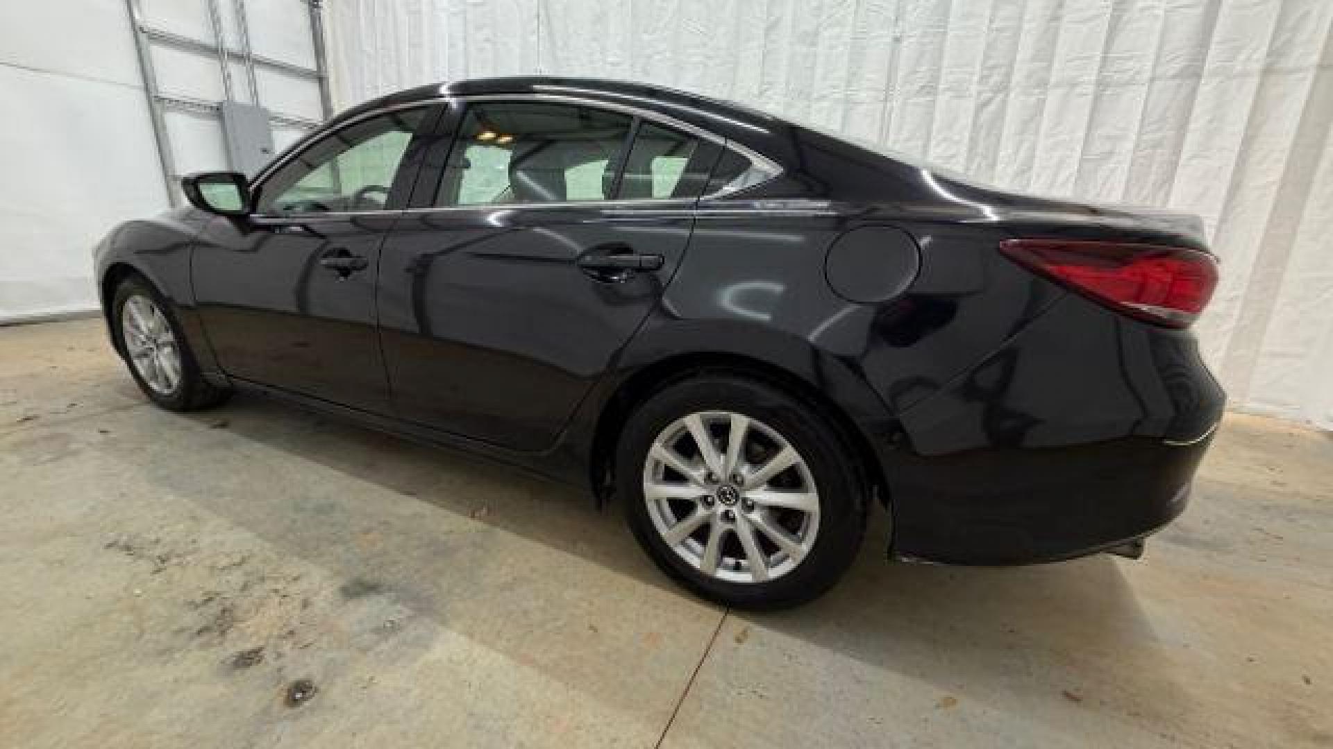 2016 Black Mazda Mazda6 i Sport (JM1GJ1U57G1) with an SKYACTIV-G 2.5L I-4 gasoline direct injection engine, located at 1806 Veterans Memorial Hwy SW, Austell, GA, 30168, (770) 944-9558, 33.817959, -84.606987 - Photo#2