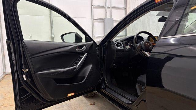 2016 Black Mazda Mazda6 i Sport (JM1GJ1U57G1) with an SKYACTIV-G 2.5L I-4 gasoline direct injection engine, located at 1806 Veterans Memorial Hwy SW, Austell, GA, 30168, (770) 944-9558, 33.817959, -84.606987 - Photo#10