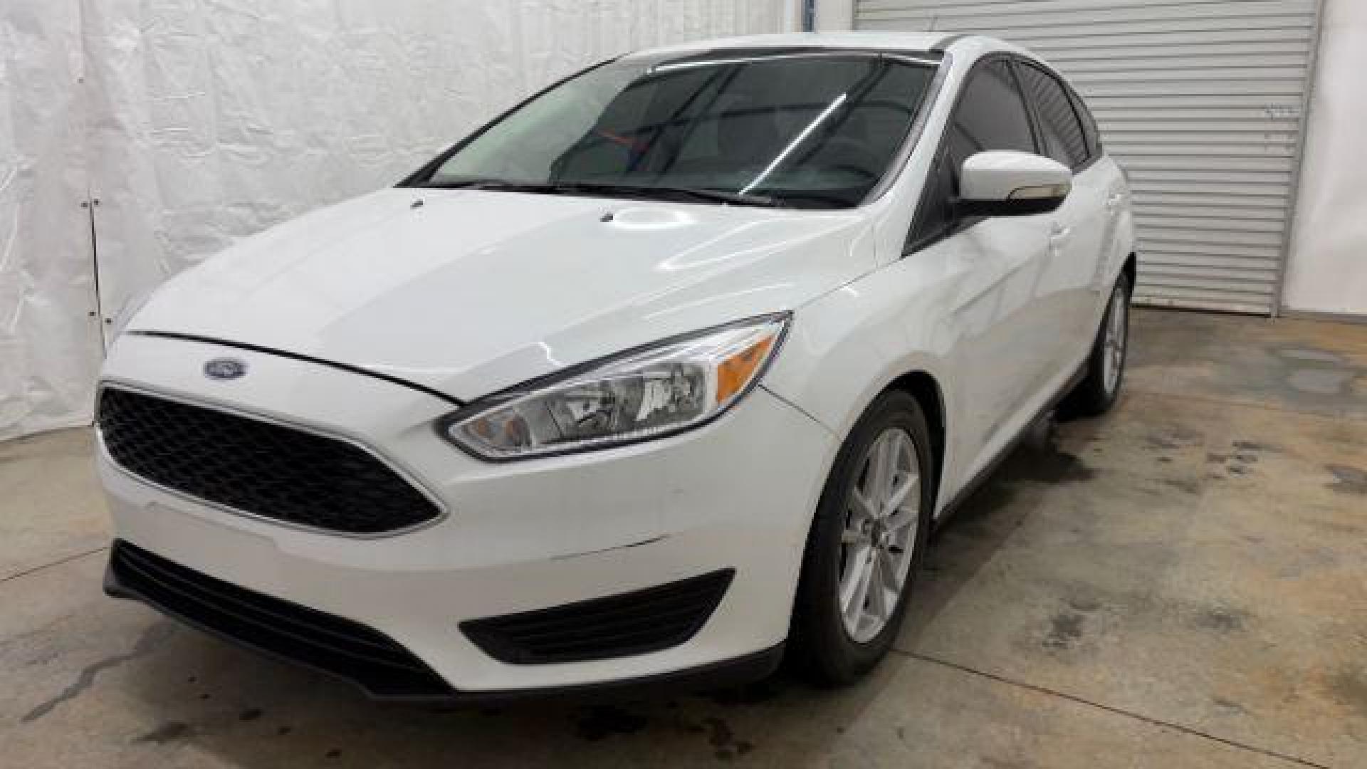 2017 White Ford Focus SE (1FADP3K26HL) with an 2L I-4 gasoline direct injection engine, located at 1806 Veterans Memorial Hwy SW, Austell, GA, 30168, (770) 944-9558, 33.817959, -84.606987 - Photo#0