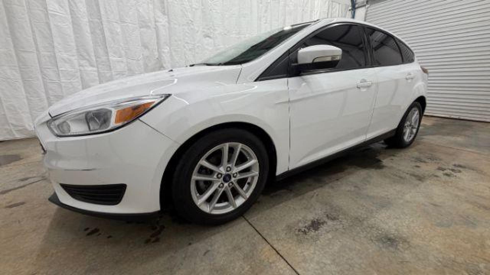 2017 White Ford Focus SE (1FADP3K26HL) with an 2L I-4 gasoline direct injection engine, located at 1806 Veterans Memorial Hwy SW, Austell, GA, 30168, (770) 944-9558, 33.817959, -84.606987 - Photo#1