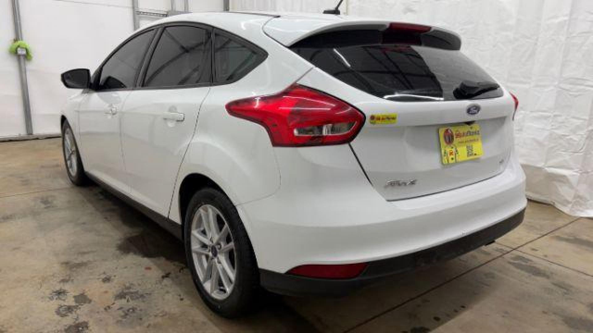 2017 White Ford Focus SE (1FADP3K26HL) with an 2L I-4 gasoline direct injection engine, located at 1806 Veterans Memorial Hwy SW, Austell, GA, 30168, (770) 944-9558, 33.817959, -84.606987 - Photo#3