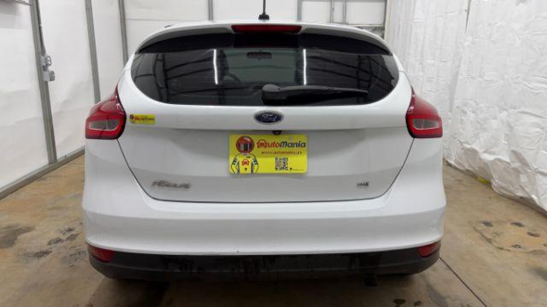 2017 White Ford Focus SE (1FADP3K26HL) with an 2L I-4 gasoline direct injection engine, located at 1806 Veterans Memorial Hwy SW, Austell, GA, 30168, (770) 944-9558, 33.817959, -84.606987 - Photo#4