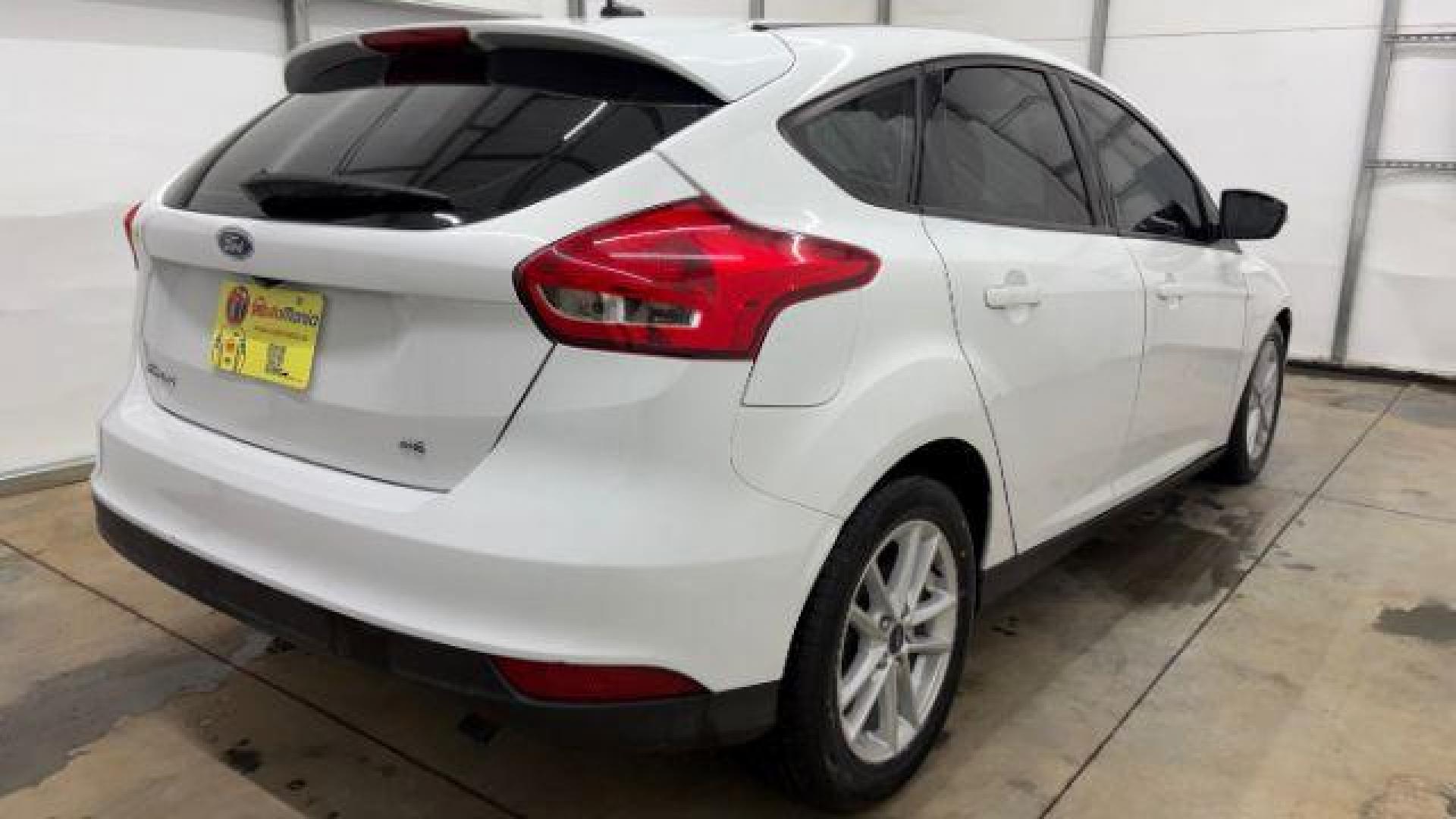 2017 White Ford Focus SE (1FADP3K26HL) with an 2L I-4 gasoline direct injection engine, located at 1806 Veterans Memorial Hwy SW, Austell, GA, 30168, (770) 944-9558, 33.817959, -84.606987 - Photo#5