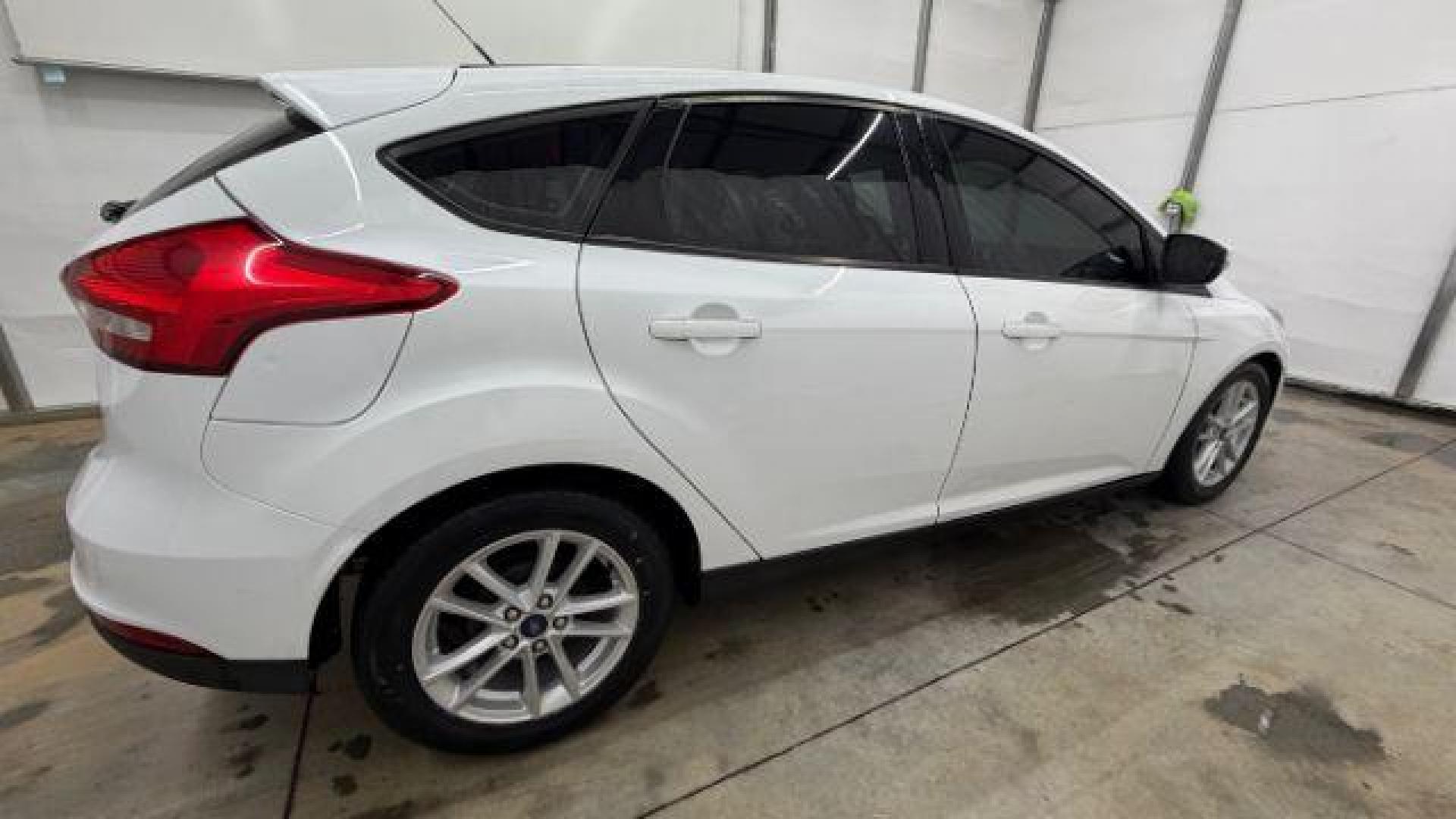 2017 White Ford Focus SE (1FADP3K26HL) with an 2L I-4 gasoline direct injection engine, located at 1806 Veterans Memorial Hwy SW, Austell, GA, 30168, (770) 944-9558, 33.817959, -84.606987 - Photo#6