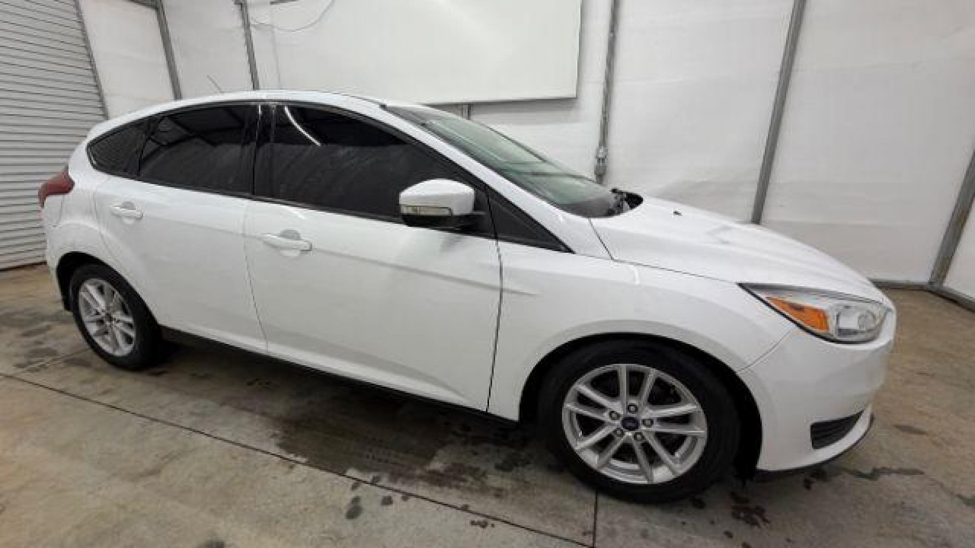 2017 White Ford Focus SE (1FADP3K26HL) with an 2L I-4 gasoline direct injection engine, located at 1806 Veterans Memorial Hwy SW, Austell, GA, 30168, (770) 944-9558, 33.817959, -84.606987 - Photo#7