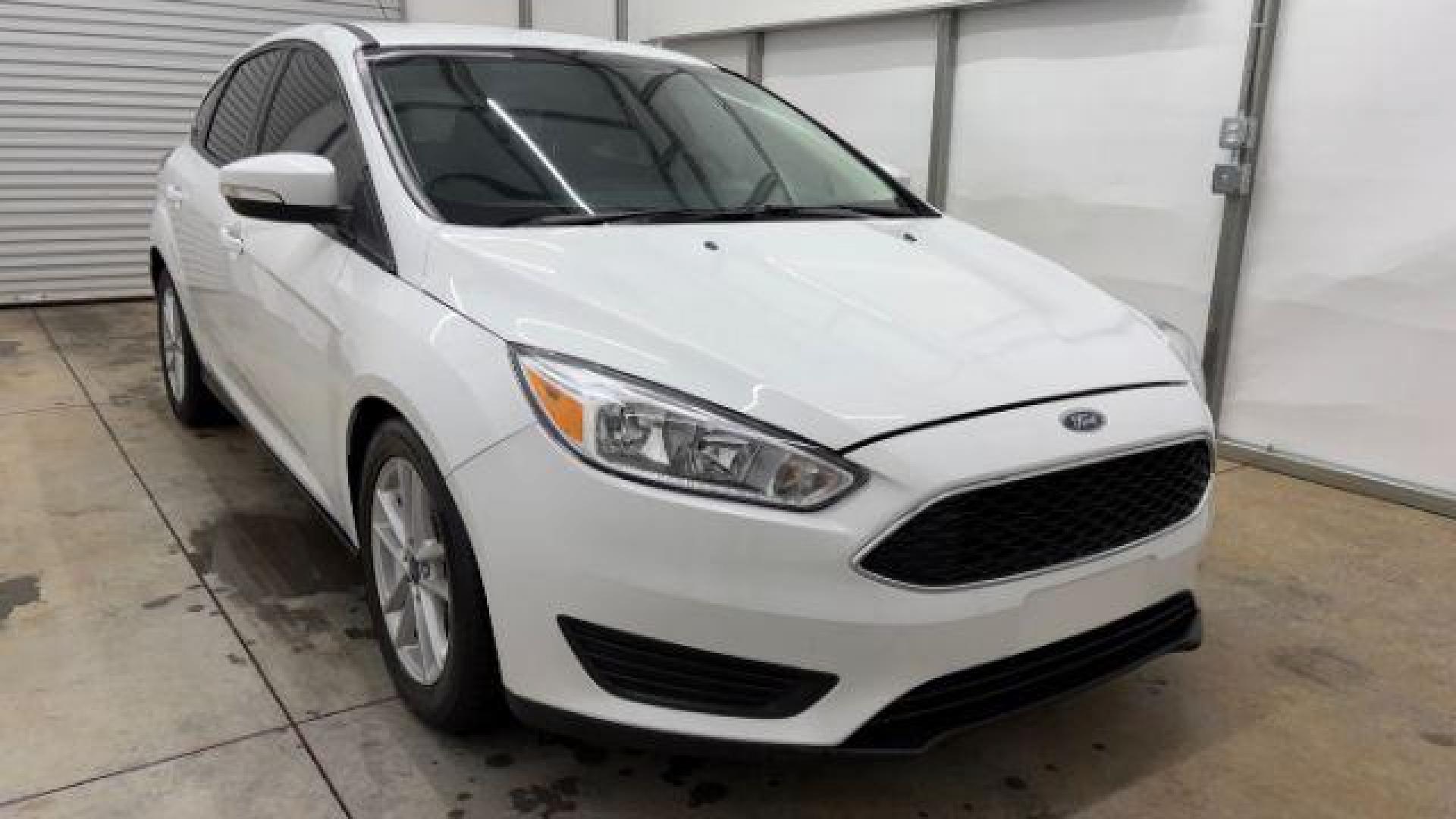 2017 White Ford Focus SE (1FADP3K26HL) with an 2L I-4 gasoline direct injection engine, located at 1806 Veterans Memorial Hwy SW, Austell, GA, 30168, (770) 944-9558, 33.817959, -84.606987 - Photo#8