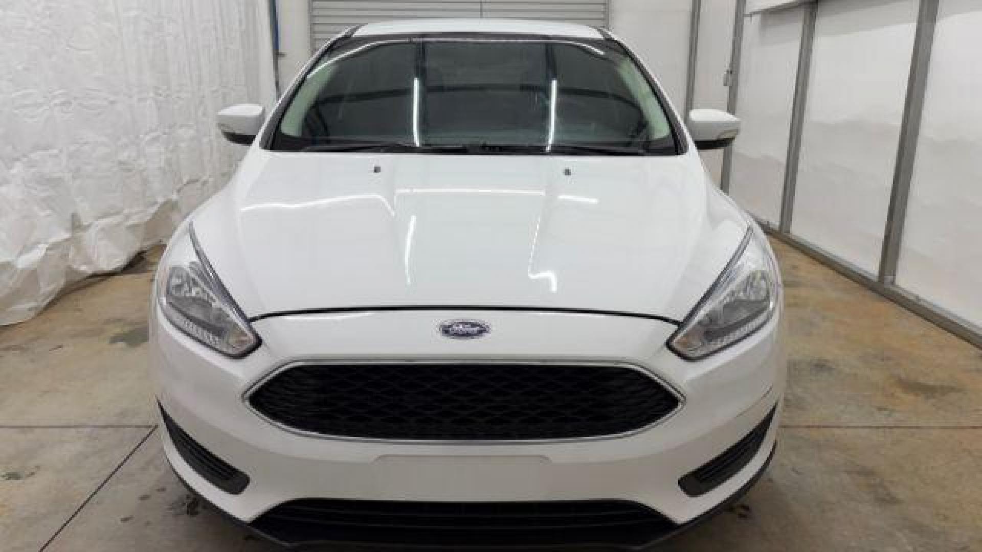 2017 White Ford Focus SE (1FADP3K26HL) with an 2L I-4 gasoline direct injection engine, located at 1806 Veterans Memorial Hwy SW, Austell, GA, 30168, (770) 944-9558, 33.817959, -84.606987 - Photo#9