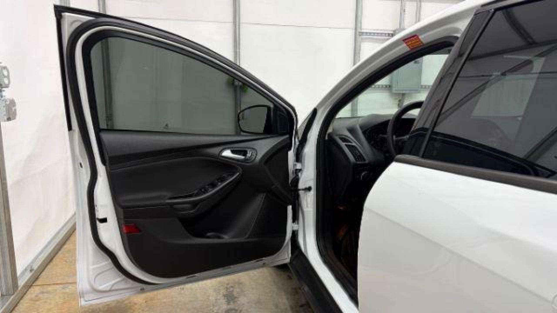 2017 White Ford Focus SE (1FADP3K26HL) with an 2L I-4 gasoline direct injection engine, located at 1806 Veterans Memorial Hwy SW, Austell, GA, 30168, (770) 944-9558, 33.817959, -84.606987 - Photo#10