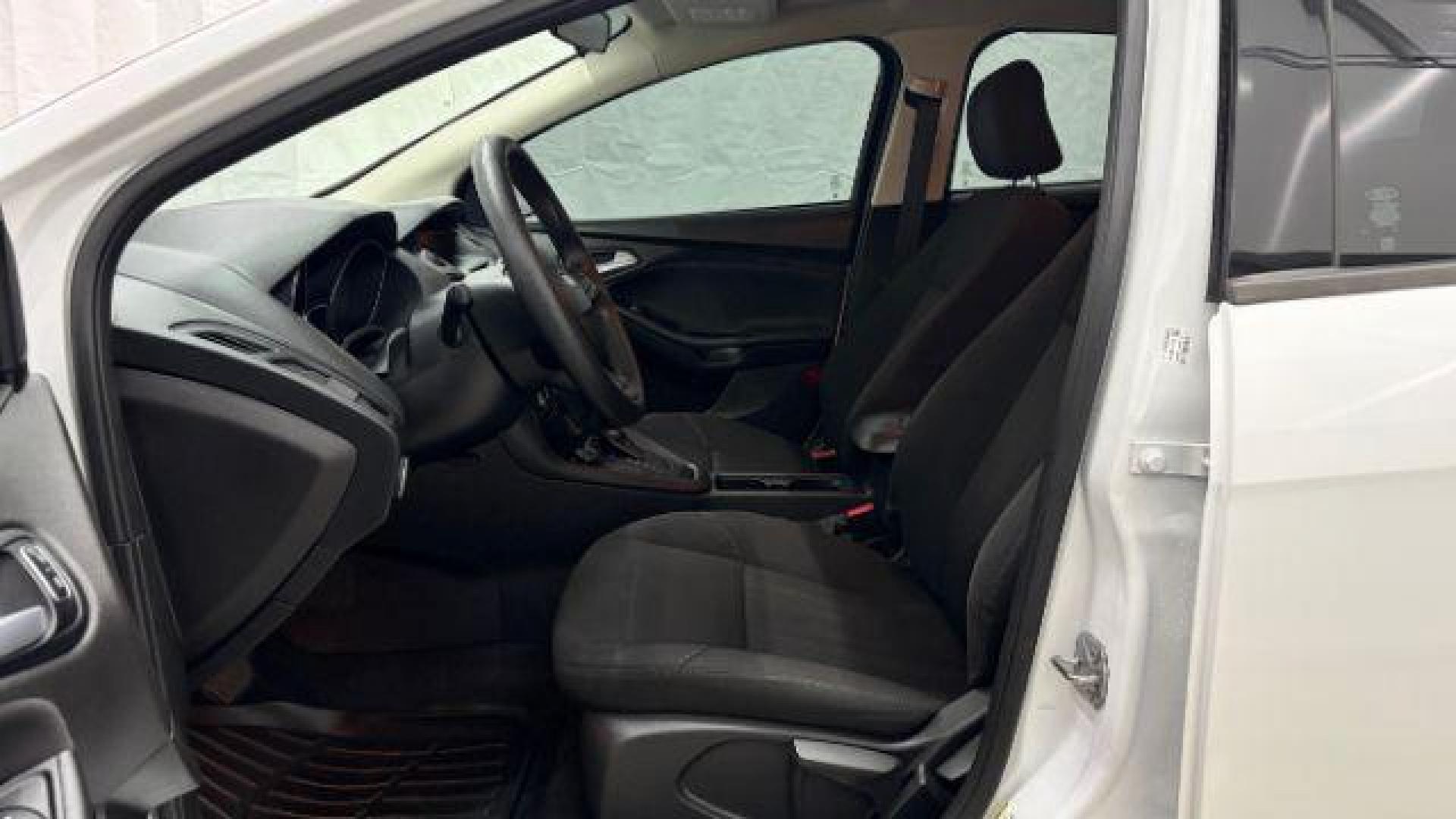 2017 White Ford Focus SE (1FADP3K26HL) with an 2L I-4 gasoline direct injection engine, located at 1806 Veterans Memorial Hwy SW, Austell, GA, 30168, (770) 944-9558, 33.817959, -84.606987 - Photo#11