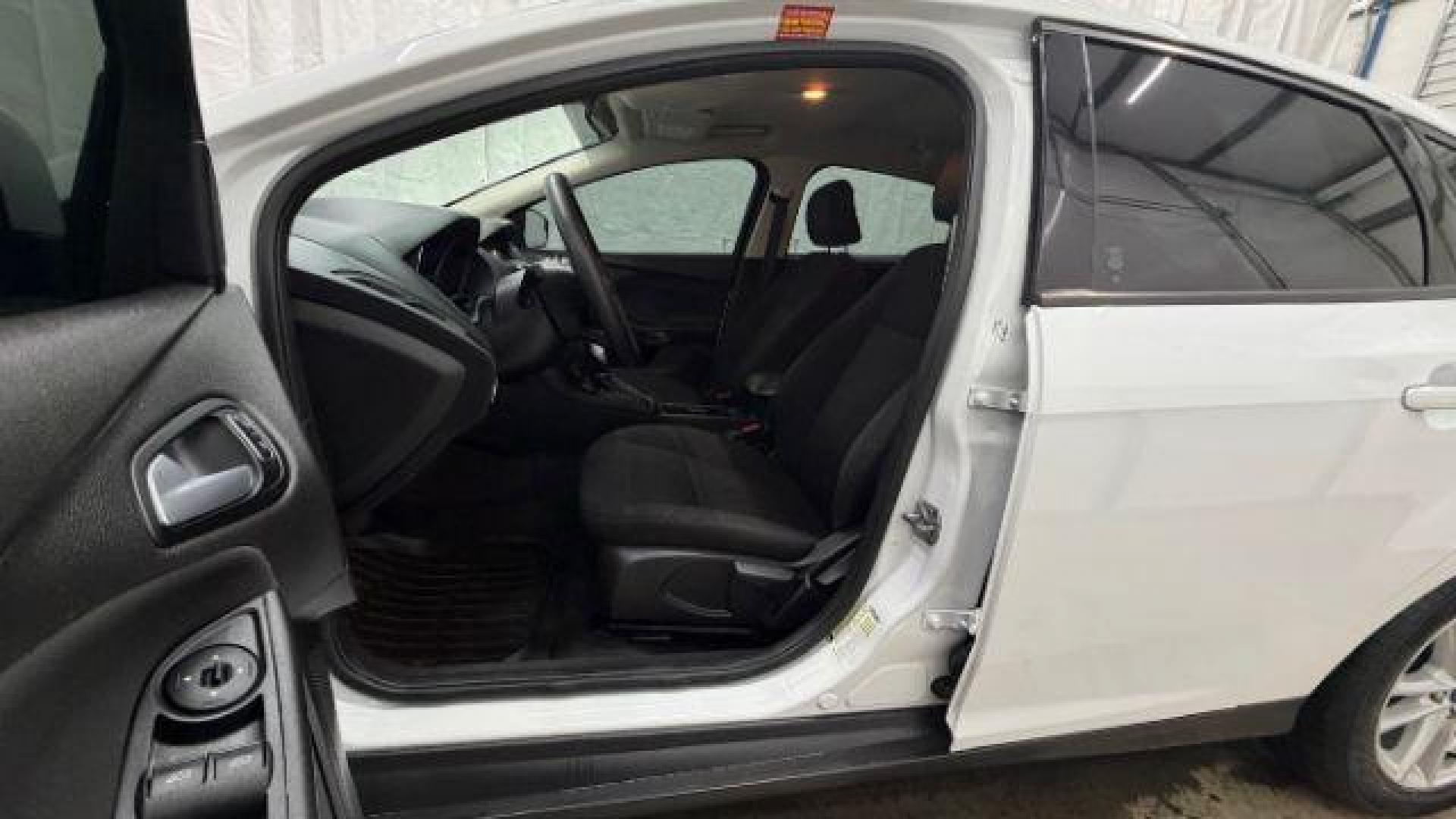 2017 White Ford Focus SE (1FADP3K26HL) with an 2L I-4 gasoline direct injection engine, located at 1806 Veterans Memorial Hwy SW, Austell, GA, 30168, (770) 944-9558, 33.817959, -84.606987 - Photo#12