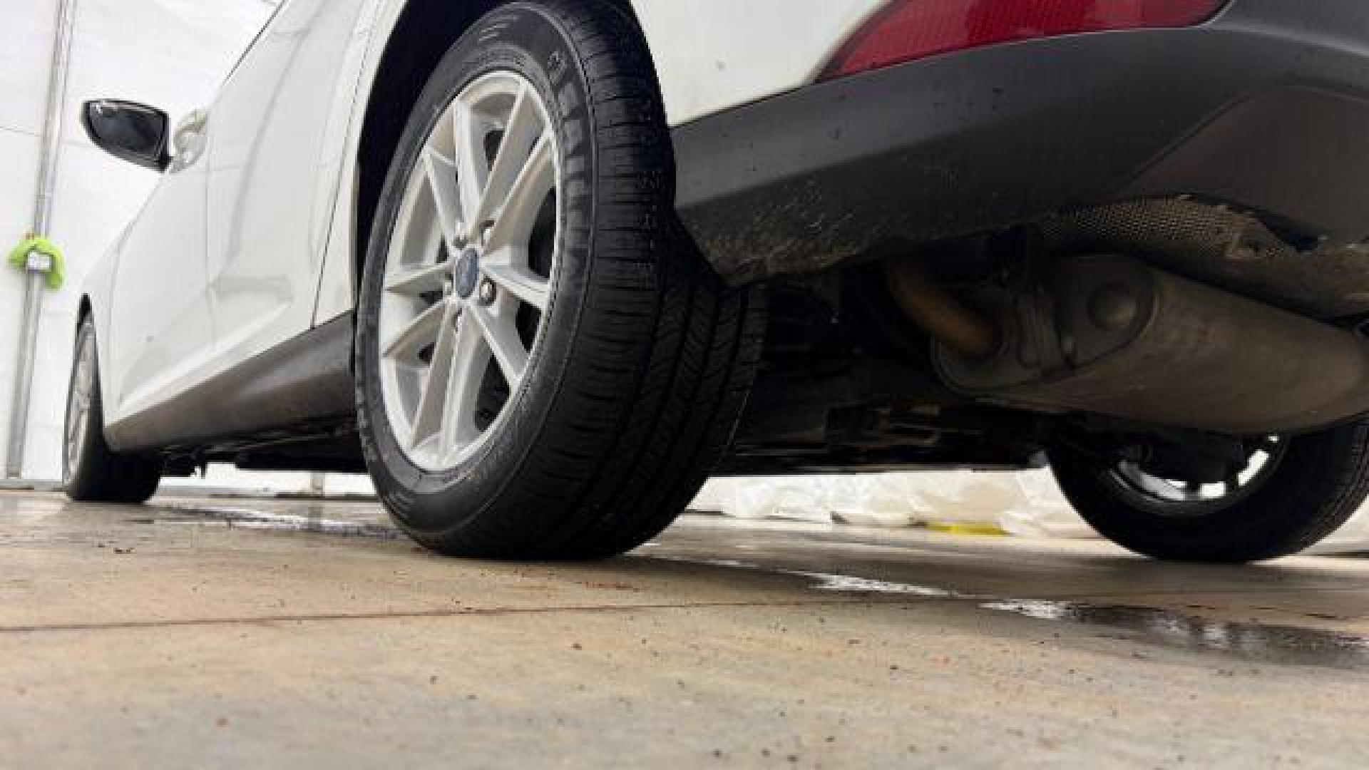 2017 White Ford Focus SE (1FADP3K26HL) with an 2L I-4 gasoline direct injection engine, located at 1806 Veterans Memorial Hwy SW, Austell, GA, 30168, (770) 944-9558, 33.817959, -84.606987 - Photo#20