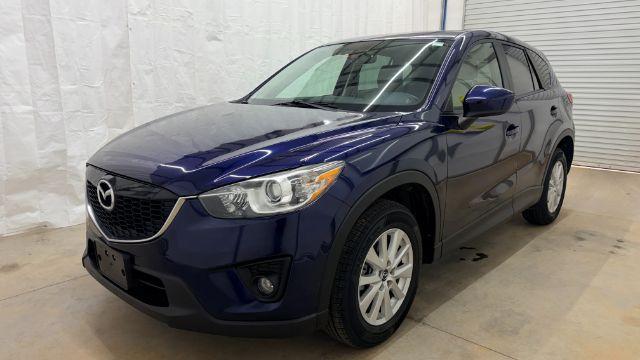 2013 Blue Mazda CX-5 Touring (JM3KE2CE4D0) with an SKYACTIV-G 2L I-4 gasoline direct injection engine, located at 1806 Veterans Memorial Hwy SW, Austell, GA, 30168, (770) 944-9558, 33.817959, -84.606987 - Photo#1