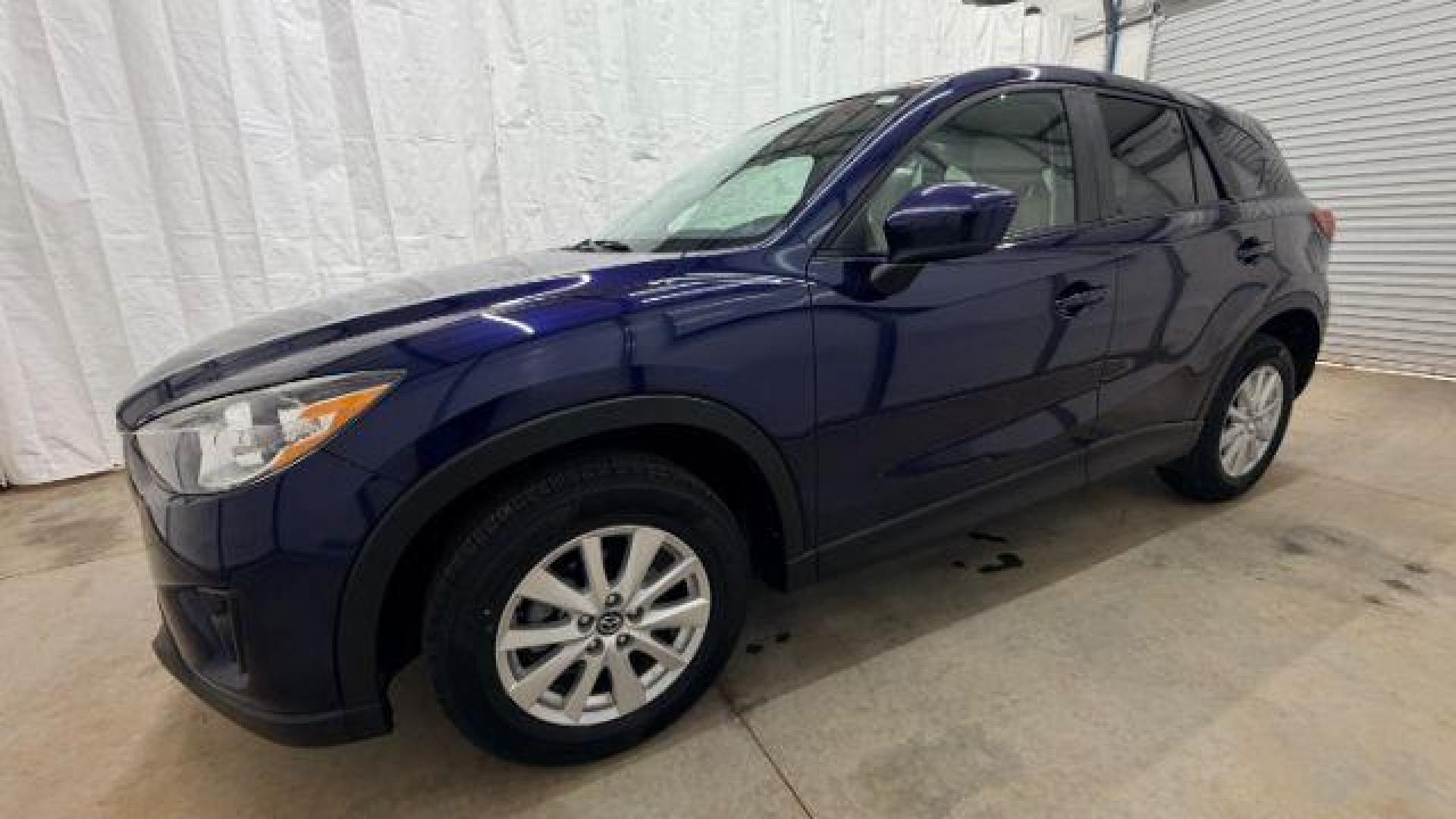 2013 Blue Mazda CX-5 Touring (JM3KE2CE4D0) with an SKYACTIV-G 2L I-4 gasoline direct injection engine, located at 1806 Veterans Memorial Hwy SW, Austell, GA, 30168, (770) 944-9558, 33.817959, -84.606987 - Photo#2