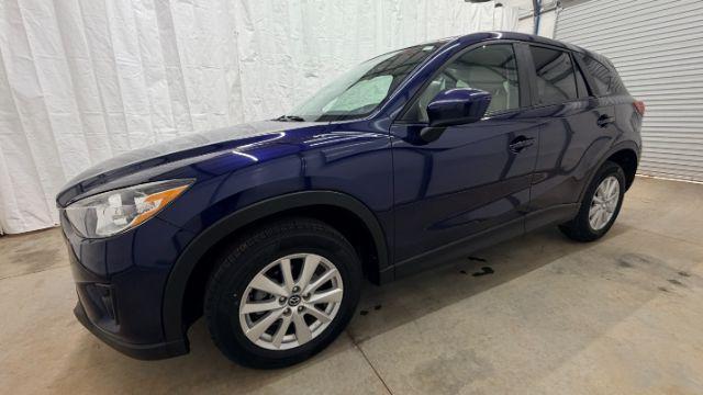 2013 Blue Mazda CX-5 Touring (JM3KE2CE4D0) with an SKYACTIV-G 2L I-4 gasoline direct injection engine, located at 1806 Veterans Memorial Hwy SW, Austell, GA, 30168, (770) 944-9558, 33.817959, -84.606987 - Photo#2
