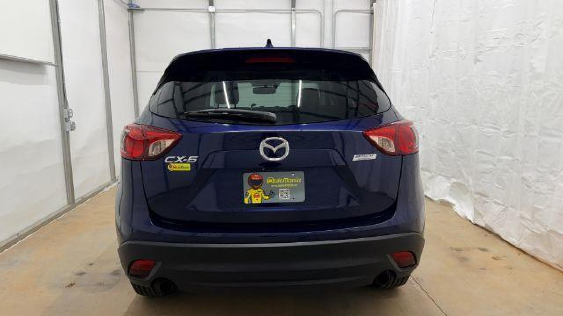 2013 Blue Mazda CX-5 Touring (JM3KE2CE4D0) with an SKYACTIV-G 2L I-4 gasoline direct injection engine, located at 1806 Veterans Memorial Hwy SW, Austell, GA, 30168, (770) 944-9558, 33.817959, -84.606987 - Photo#5