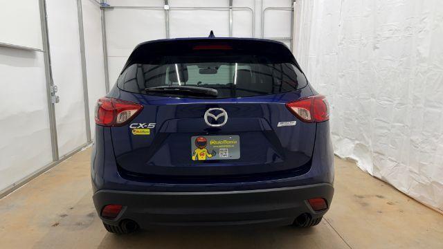 2013 Blue Mazda CX-5 Touring (JM3KE2CE4D0) with an SKYACTIV-G 2L I-4 gasoline direct injection engine, located at 1806 Veterans Memorial Hwy SW, Austell, GA, 30168, (770) 944-9558, 33.817959, -84.606987 - Photo#5