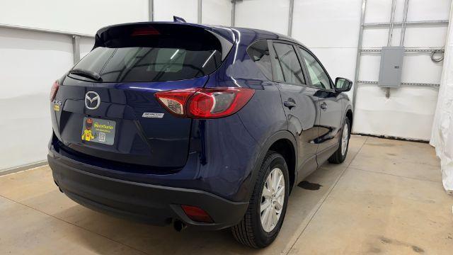 2013 Blue Mazda CX-5 Touring (JM3KE2CE4D0) with an SKYACTIV-G 2L I-4 gasoline direct injection engine, located at 1806 Veterans Memorial Hwy SW, Austell, GA, 30168, (770) 944-9558, 33.817959, -84.606987 - Photo#6