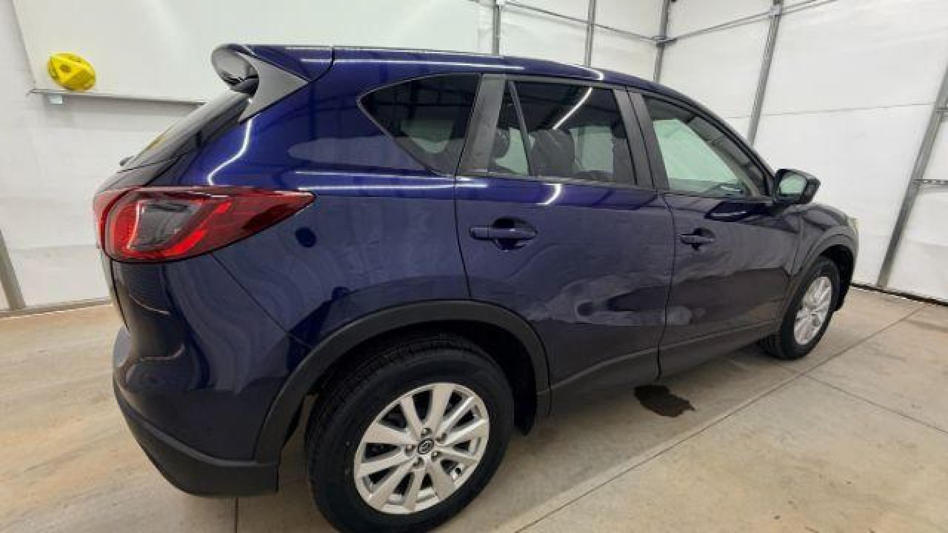 2013 Blue Mazda CX-5 Touring (JM3KE2CE4D0) with an SKYACTIV-G 2L I-4 gasoline direct injection engine, located at 1806 Veterans Memorial Hwy SW, Austell, GA, 30168, (770) 944-9558, 33.817959, -84.606987 - Photo#7