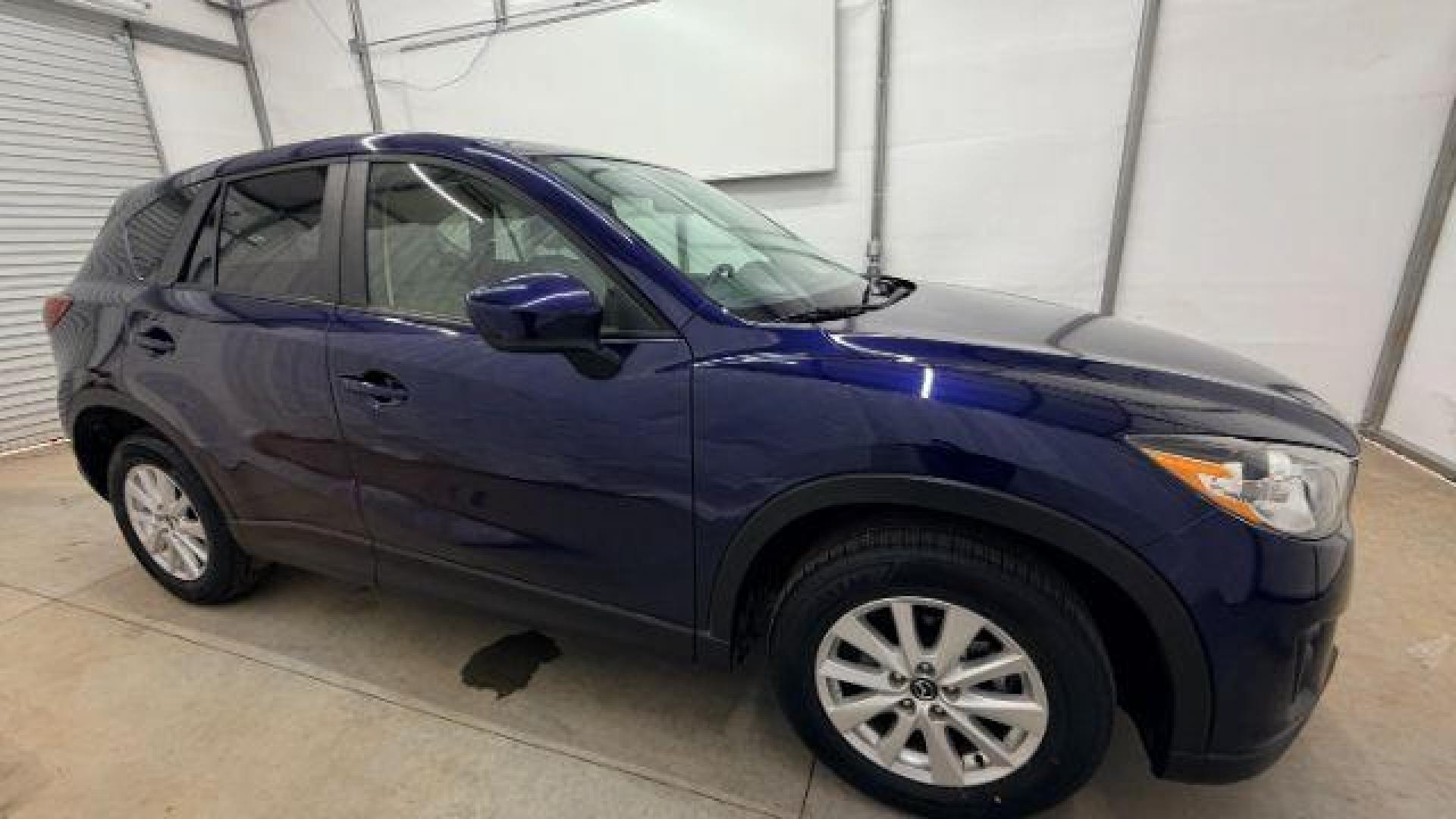 2013 Blue Mazda CX-5 Touring (JM3KE2CE4D0) with an SKYACTIV-G 2L I-4 gasoline direct injection engine, located at 1806 Veterans Memorial Hwy SW, Austell, GA, 30168, (770) 944-9558, 33.817959, -84.606987 - Photo#8