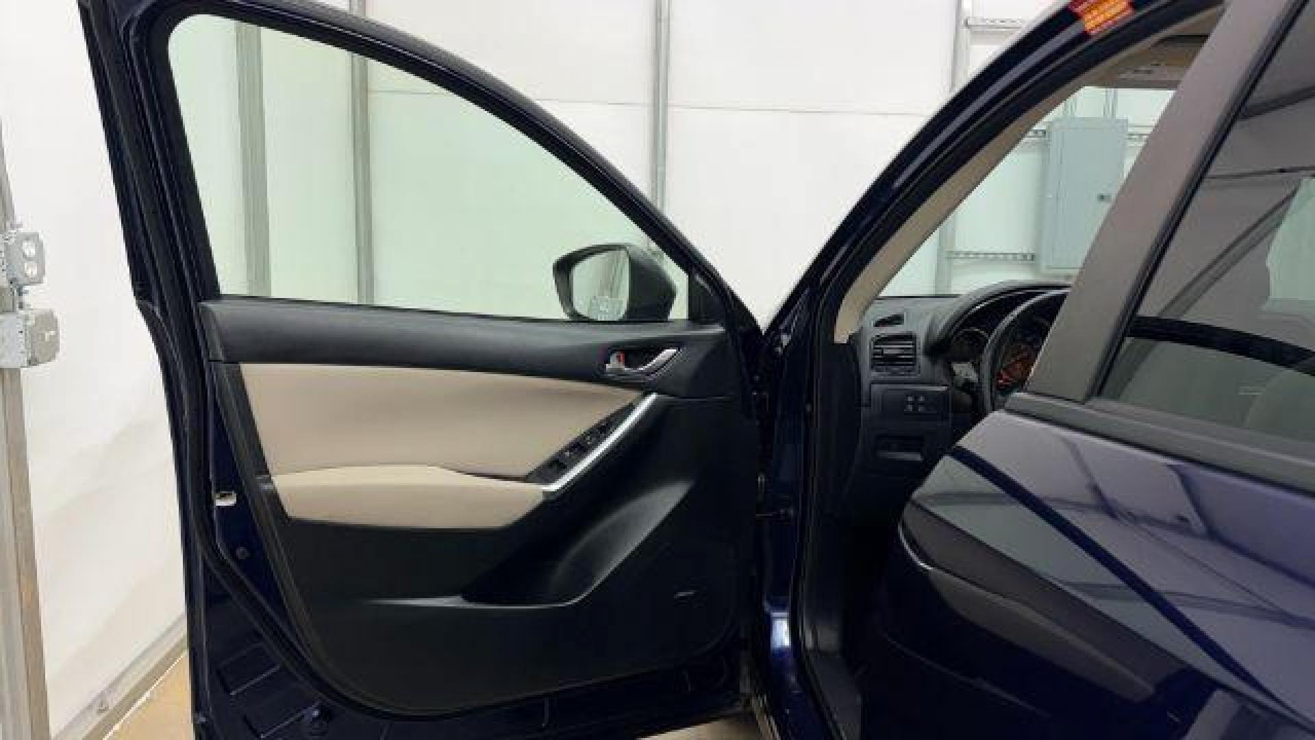 2013 Blue Mazda CX-5 Touring (JM3KE2CE4D0) with an SKYACTIV-G 2L I-4 gasoline direct injection engine, located at 1806 Veterans Memorial Hwy SW, Austell, GA, 30168, (770) 944-9558, 33.817959, -84.606987 - Photo#10