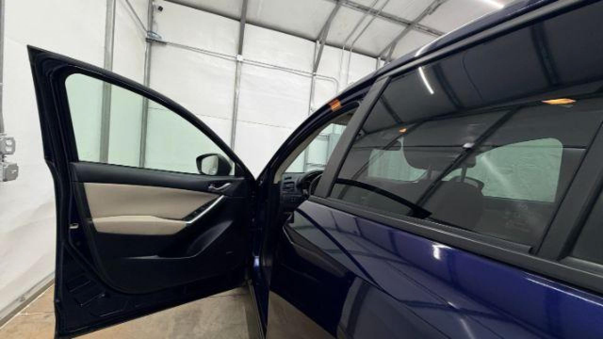 2013 Blue Mazda CX-5 Touring (JM3KE2CE4D0) with an SKYACTIV-G 2L I-4 gasoline direct injection engine, located at 1806 Veterans Memorial Hwy SW, Austell, GA, 30168, (770) 944-9558, 33.817959, -84.606987 - Photo#11