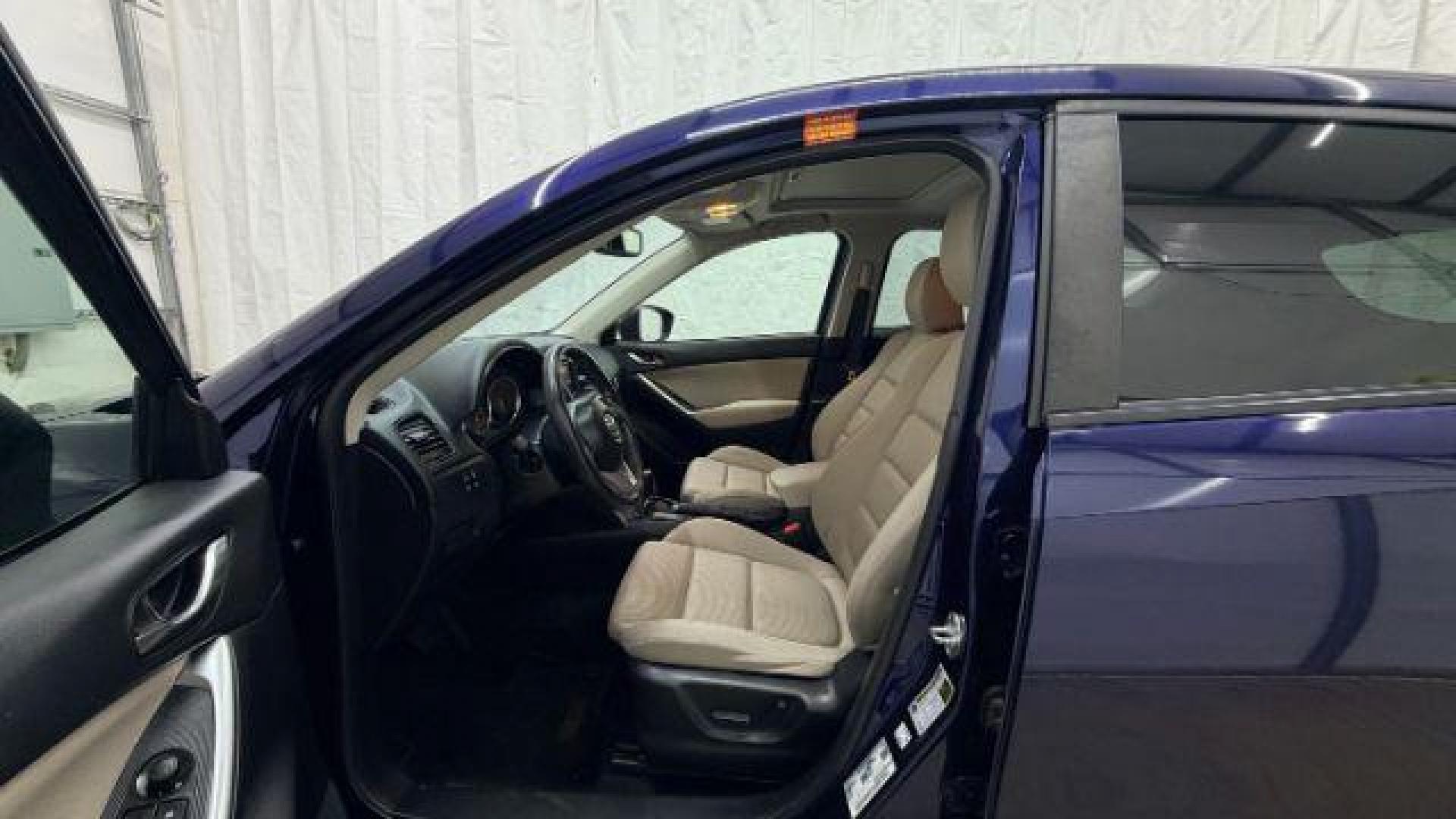 2013 Blue Mazda CX-5 Touring (JM3KE2CE4D0) with an SKYACTIV-G 2L I-4 gasoline direct injection engine, located at 1806 Veterans Memorial Hwy SW, Austell, GA, 30168, (770) 944-9558, 33.817959, -84.606987 - Photo#13