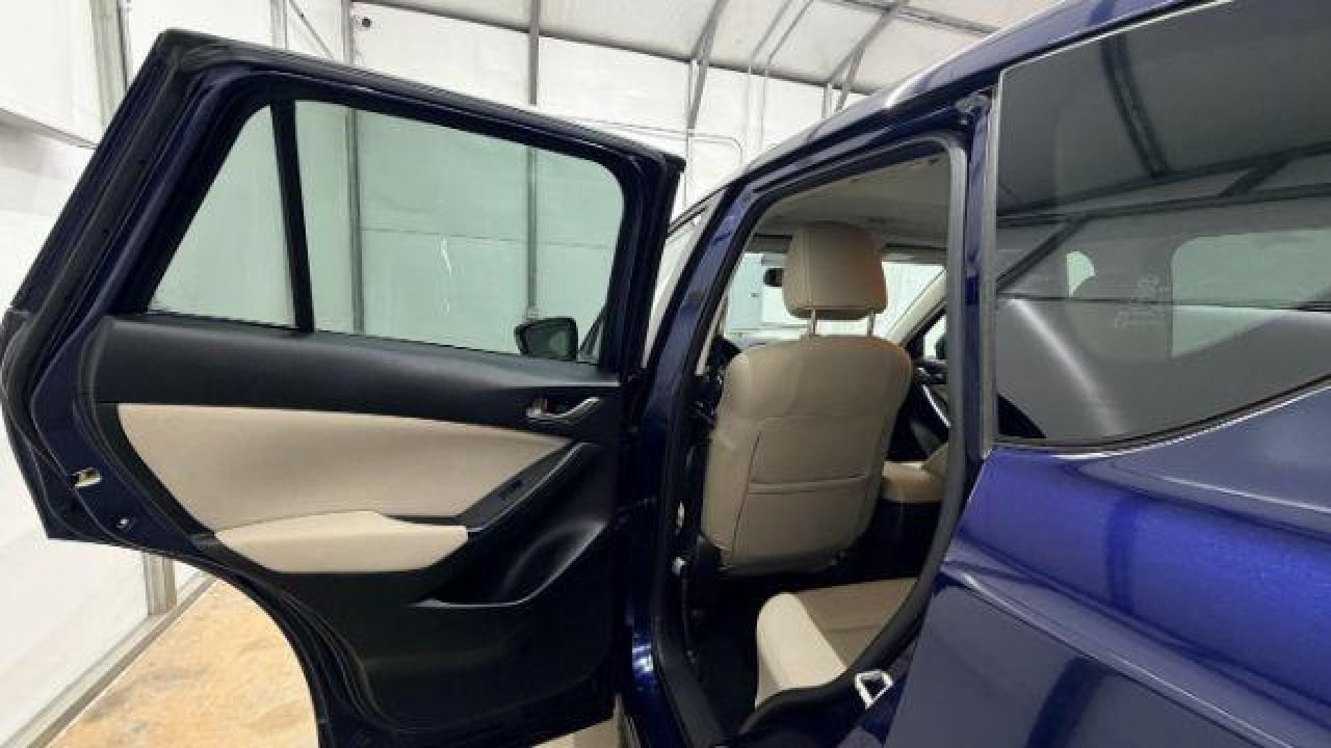 2013 Blue Mazda CX-5 Touring (JM3KE2CE4D0) with an SKYACTIV-G 2L I-4 gasoline direct injection engine, located at 1806 Veterans Memorial Hwy SW, Austell, GA, 30168, (770) 944-9558, 33.817959, -84.606987 - Photo#14