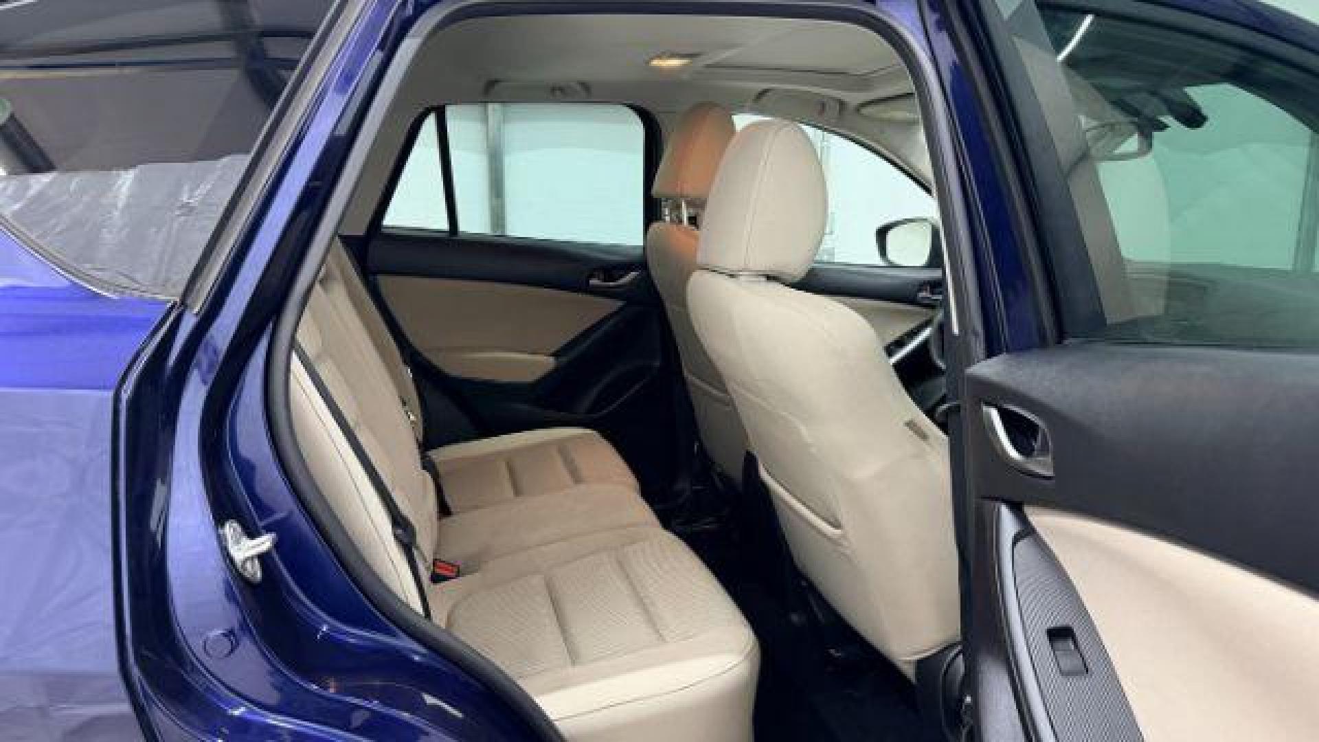 2013 Blue Mazda CX-5 Touring (JM3KE2CE4D0) with an SKYACTIV-G 2L I-4 gasoline direct injection engine, located at 1806 Veterans Memorial Hwy SW, Austell, GA, 30168, (770) 944-9558, 33.817959, -84.606987 - Photo#17