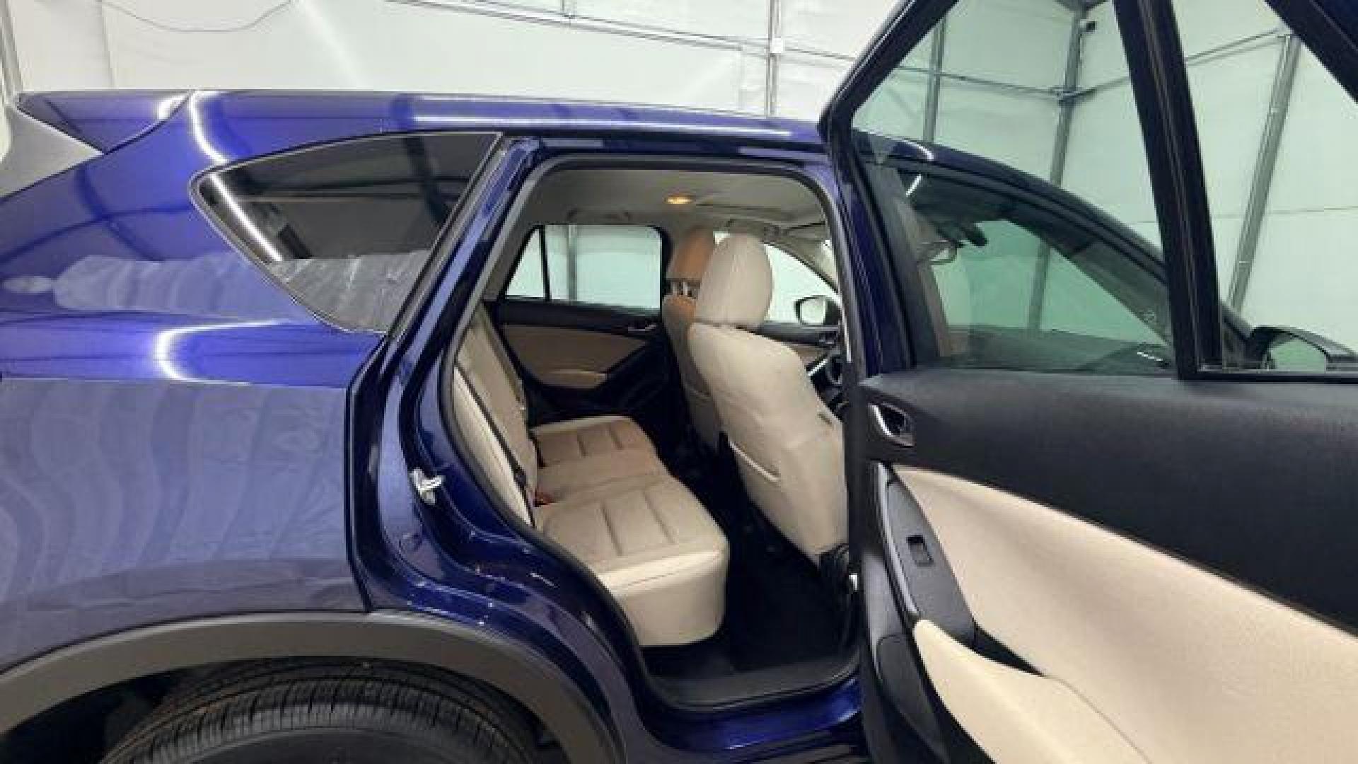 2013 Blue Mazda CX-5 Touring (JM3KE2CE4D0) with an SKYACTIV-G 2L I-4 gasoline direct injection engine, located at 1806 Veterans Memorial Hwy SW, Austell, GA, 30168, (770) 944-9558, 33.817959, -84.606987 - Photo#18