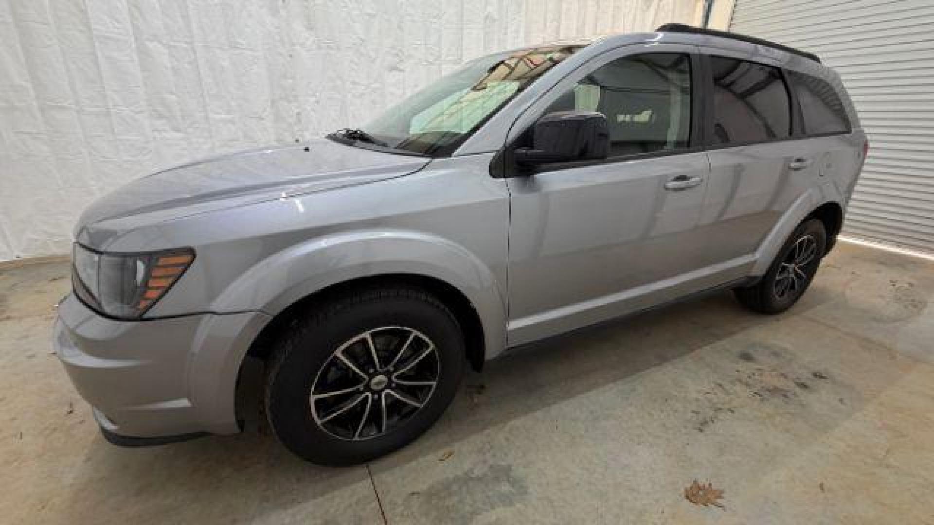 2018 Gray Dodge Journey SE (3C4PDCABXJT) with an Tigershark MultiAir 2.4L I-4 DOHC engine, located at 1806 Veterans Memorial Hwy SW, Austell, GA, 30168, (770) 944-9558, 33.817959, -84.606987 - Photo#1