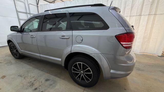 2018 Gray Dodge Journey SE (3C4PDCABXJT) with an Tigershark MultiAir 2.4L I-4 DOHC engine, located at 1806 Veterans Memorial Hwy SW, Austell, GA, 30168, (770) 944-9558, 33.817959, -84.606987 - Photo#2