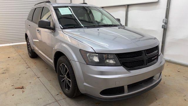 2018 Gray Dodge Journey SE (3C4PDCABXJT) with an Tigershark MultiAir 2.4L I-4 DOHC engine, located at 1806 Veterans Memorial Hwy SW, Austell, GA, 30168, (770) 944-9558, 33.817959, -84.606987 - Photo#8