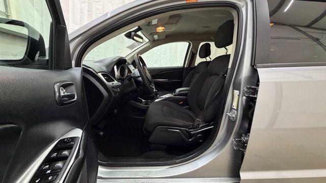 2018 Gray Dodge Journey SE (3C4PDCABXJT) with an Tigershark MultiAir 2.4L I-4 DOHC engine, located at 1806 Veterans Memorial Hwy SW, Austell, GA, 30168, (770) 944-9558, 33.817959, -84.606987 - Photo#12