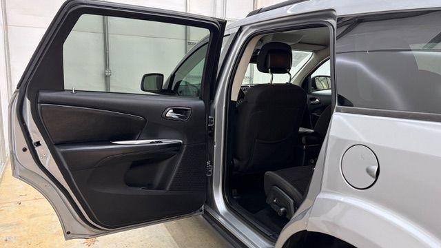 2018 Gray Dodge Journey SE (3C4PDCABXJT) with an Tigershark MultiAir 2.4L I-4 DOHC engine, located at 1806 Veterans Memorial Hwy SW, Austell, GA, 30168, (770) 944-9558, 33.817959, -84.606987 - Photo#13