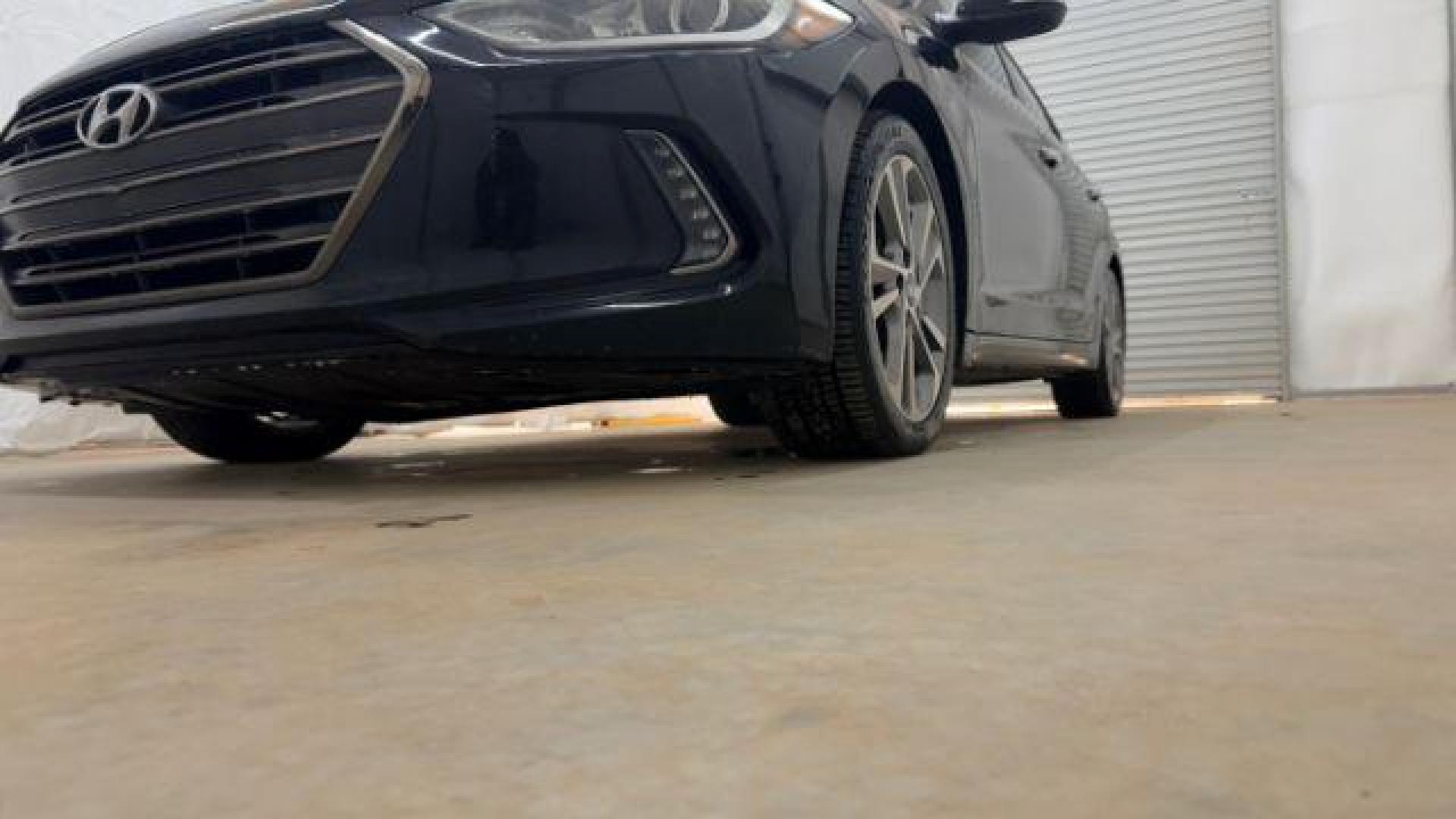 2017 Black Hyundai Elantra Limited (5NPD84LF5HH) with an Nu 2L I-4 DOHC engine, located at 1806 Veterans Memorial Hwy SW, Austell, GA, 30168, (770) 944-9558, 33.817959, -84.606987 - Photo#19