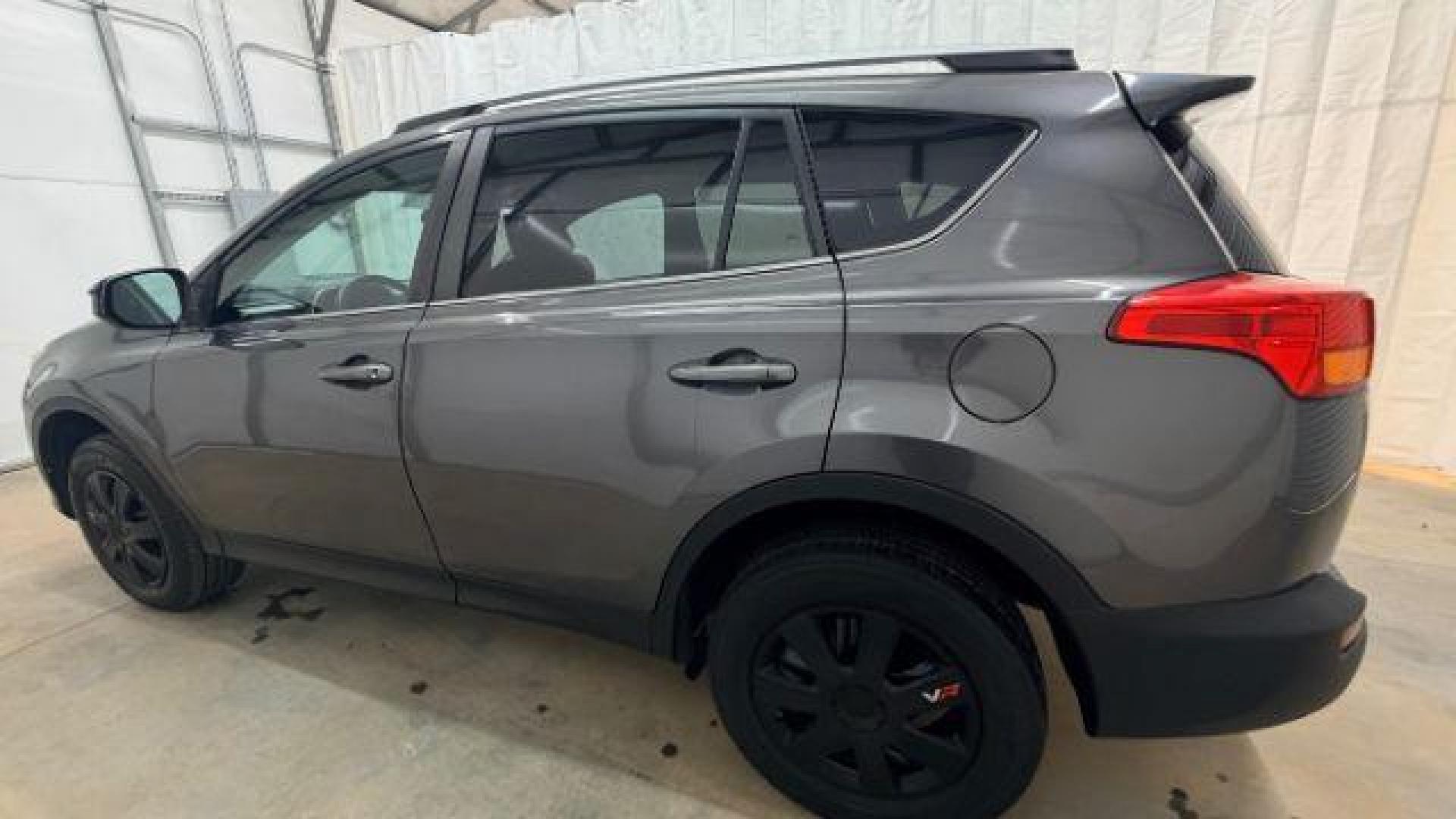 2014 gray Toyota RAV4 LE (2T3ZFREV2EW) with an 2.5L I-4 DOHC engine, located at 1806 Veterans Memorial Hwy SW, Austell, GA, 30168, (770) 944-9558, 33.817959, -84.606987 - Photo#2