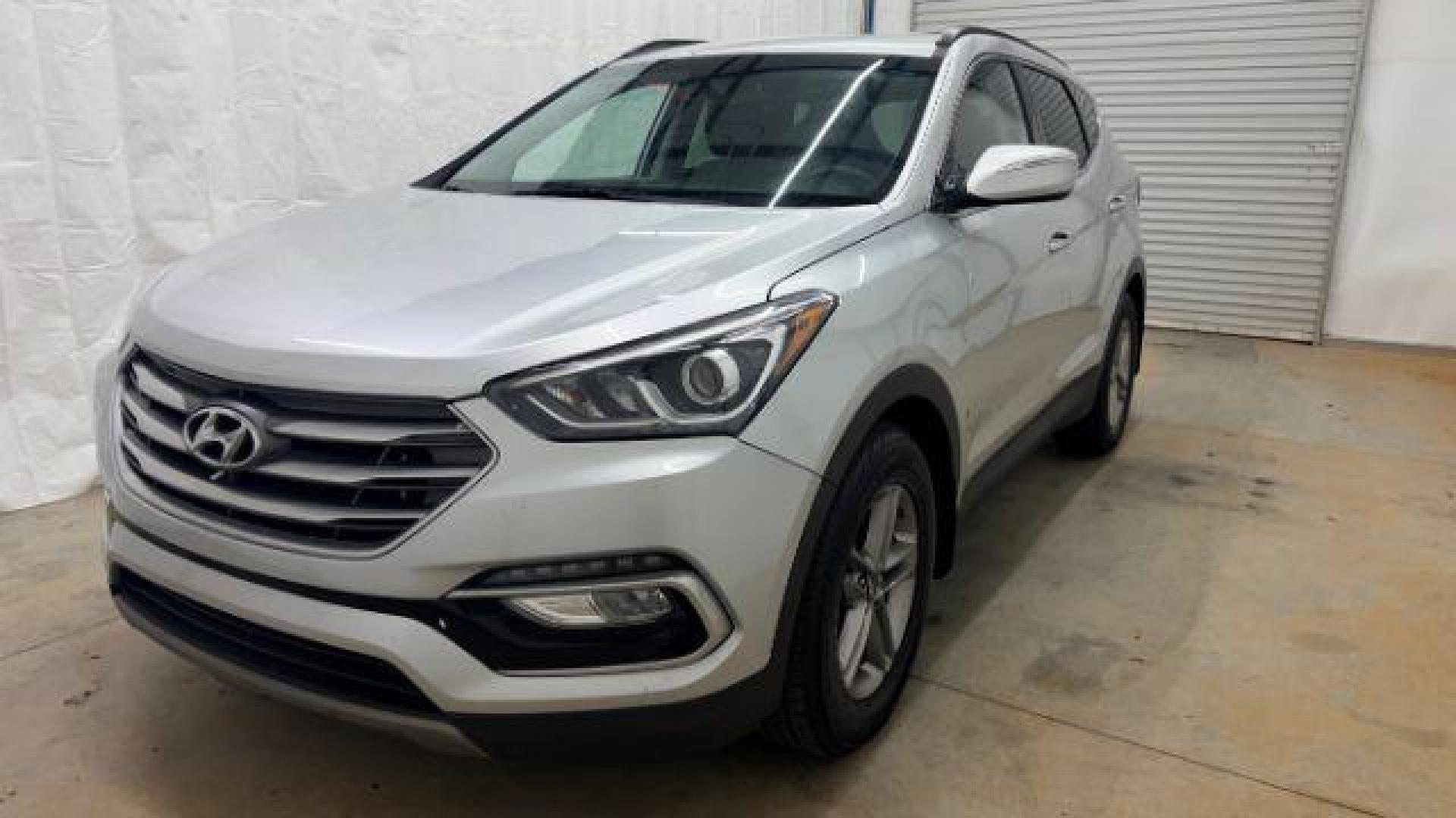 2018 Silver Hyundai Santa Fe Sport 2.4L (5XYZUDLB5JG) with an Theta II 2.4L I-4 gasoline direct injection engine, located at 1806 Veterans Memorial Hwy SW, Austell, GA, 30168, (770) 944-9558, 33.817959, -84.606987 - Photo#0