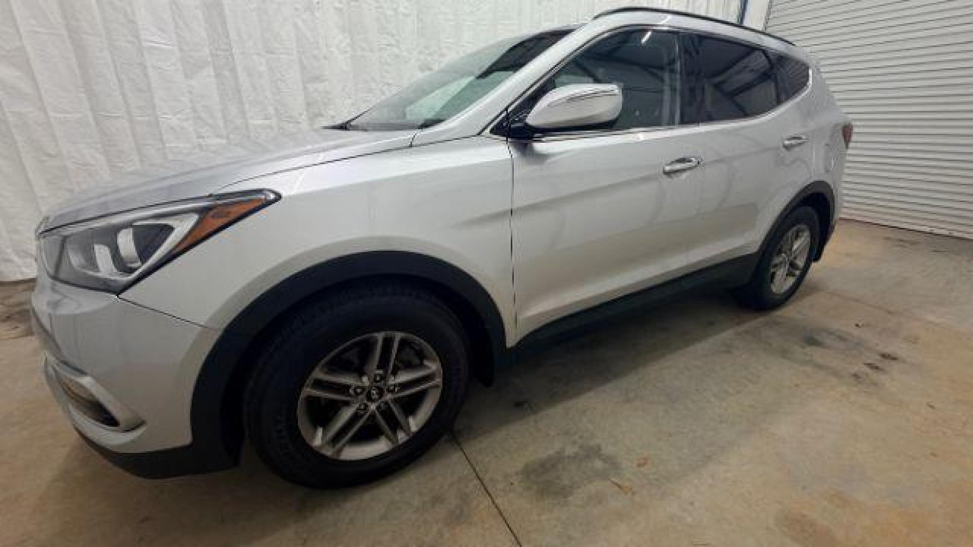 2018 Silver Hyundai Santa Fe Sport 2.4L (5XYZUDLB5JG) with an Theta II 2.4L I-4 gasoline direct injection engine, located at 1806 Veterans Memorial Hwy SW, Austell, GA, 30168, (770) 944-9558, 33.817959, -84.606987 - Photo#1