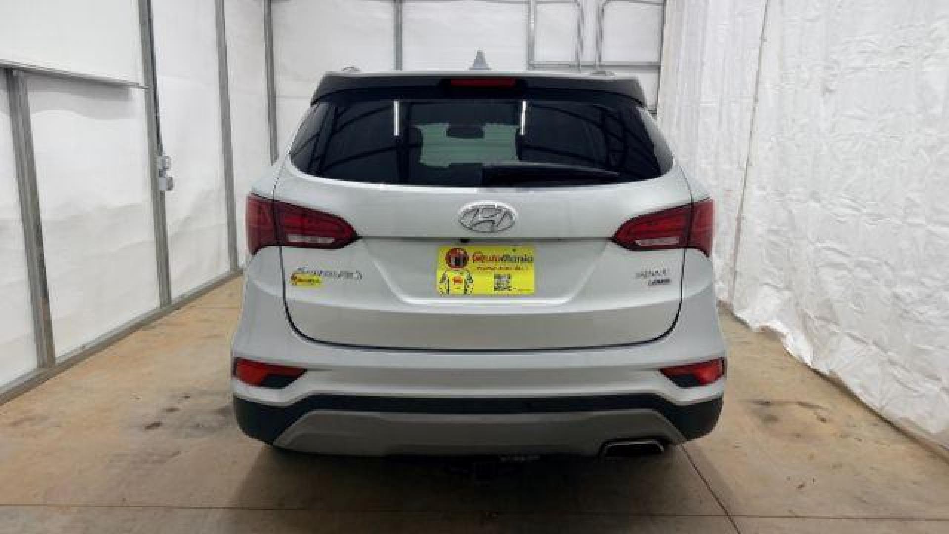 2018 Silver Hyundai Santa Fe Sport 2.4L (5XYZUDLB5JG) with an Theta II 2.4L I-4 gasoline direct injection engine, located at 1806 Veterans Memorial Hwy SW, Austell, GA, 30168, (770) 944-9558, 33.817959, -84.606987 - Photo#4