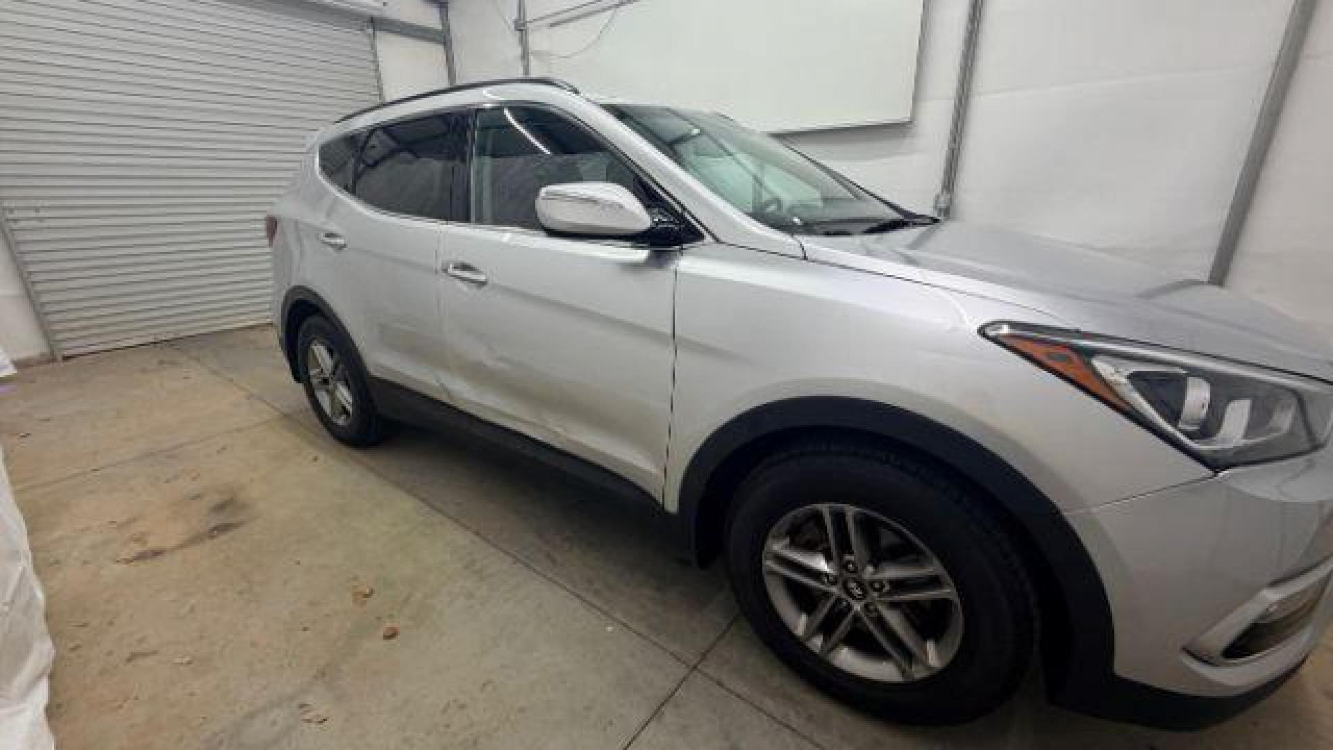 2018 Silver Hyundai Santa Fe Sport 2.4L (5XYZUDLB5JG) with an Theta II 2.4L I-4 gasoline direct injection engine, located at 1806 Veterans Memorial Hwy SW, Austell, GA, 30168, (770) 944-9558, 33.817959, -84.606987 - Photo#7