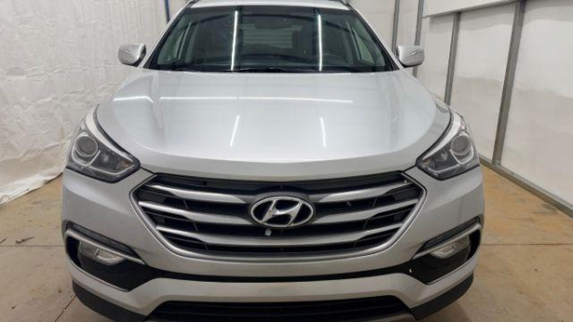 2018 Silver Hyundai Santa Fe Sport 2.4L (5XYZUDLB5JG) with an Theta II 2.4L I-4 gasoline direct injection engine, located at 1806 Veterans Memorial Hwy SW, Austell, GA, 30168, (770) 944-9558, 33.817959, -84.606987 - Photo#9