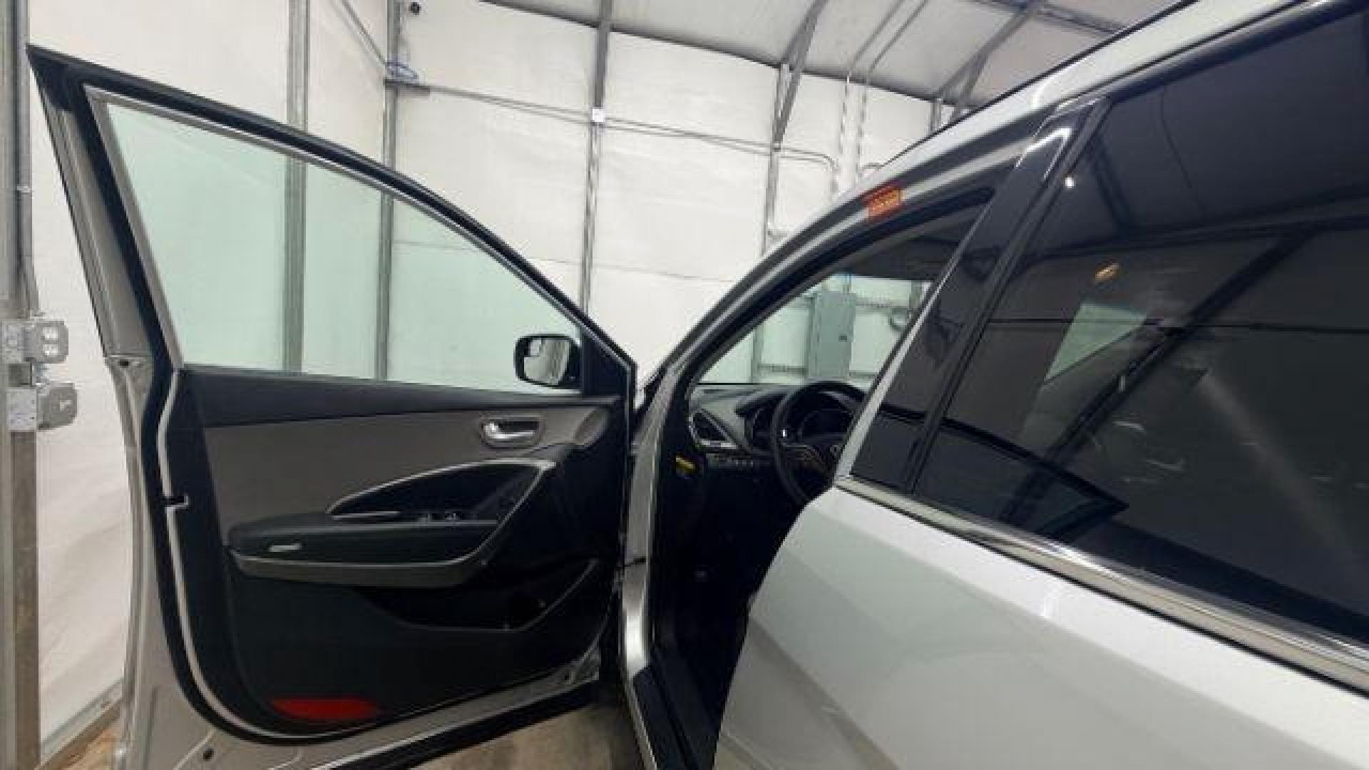 2018 Silver Hyundai Santa Fe Sport 2.4L (5XYZUDLB5JG) with an Theta II 2.4L I-4 gasoline direct injection engine, located at 1806 Veterans Memorial Hwy SW, Austell, GA, 30168, (770) 944-9558, 33.817959, -84.606987 - Photo#10