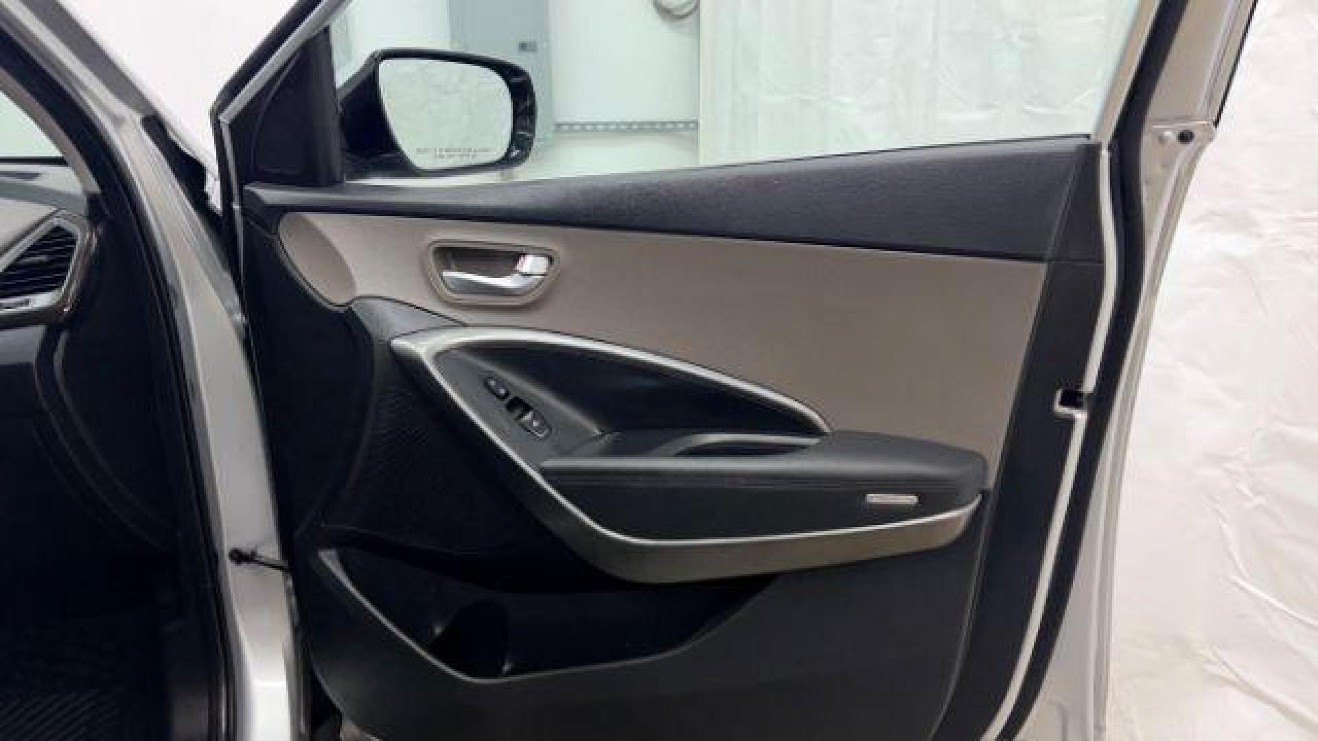 2018 Silver Hyundai Santa Fe Sport 2.4L (5XYZUDLB5JG) with an Theta II 2.4L I-4 gasoline direct injection engine, located at 1806 Veterans Memorial Hwy SW, Austell, GA, 30168, (770) 944-9558, 33.817959, -84.606987 - Photo#19