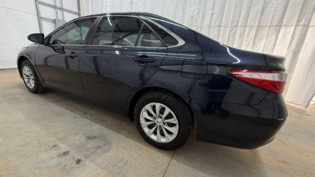 2017 Blue Toyota Camry LE (4T1BF1FKXHU) with an 2.5L I-4 DOHC engine, located at 1806 Veterans Memorial Hwy SW, Austell, GA, 30168, (770) 944-9558, 33.817959, -84.606987 - Photo#2