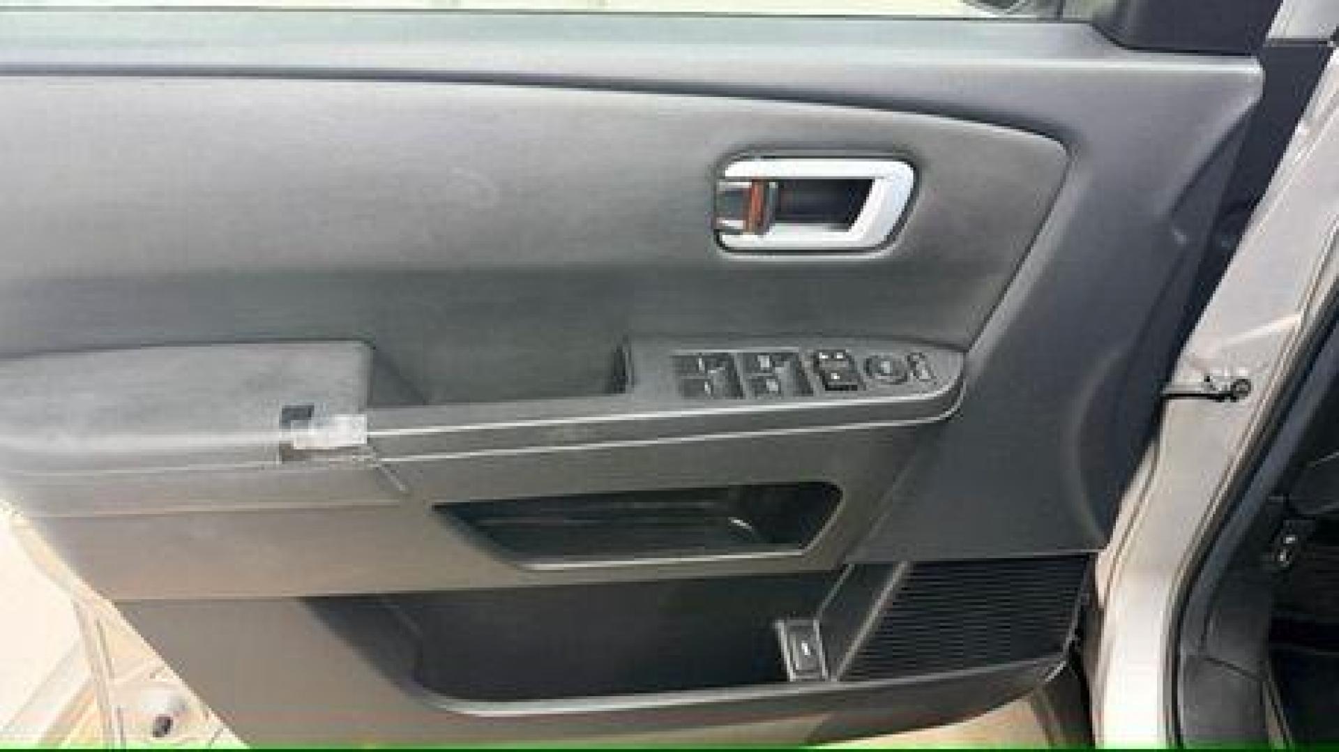 2012 Silver Honda Pilot EX-L (5FNYF3H65CB) with an 3.5L V-6 i-VTEC VCM variable valve control engine, located at 1806 Veterans Memorial Hwy SW, Austell, GA, 30168, (770) 944-9558, 33.817959, -84.606987 - Photo#10