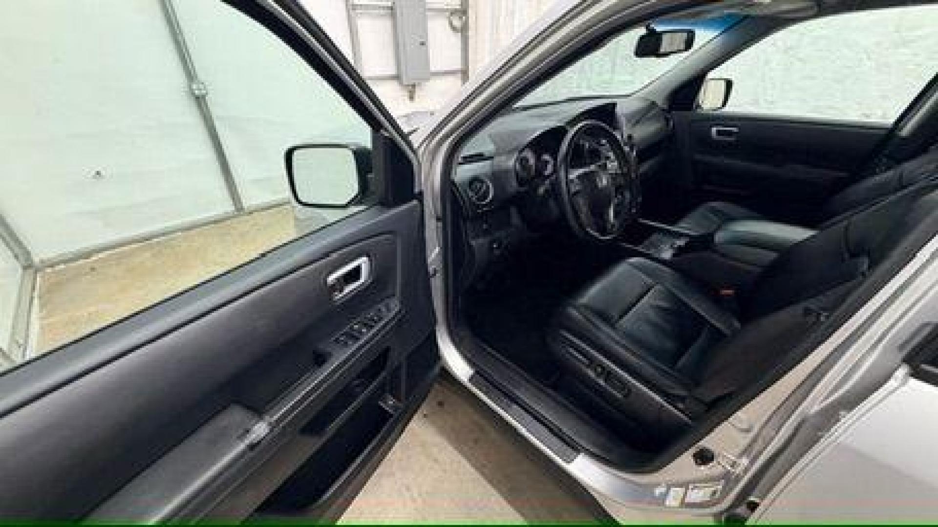 2012 Silver Honda Pilot EX-L (5FNYF3H65CB) with an 3.5L V-6 i-VTEC VCM variable valve control engine, located at 1806 Veterans Memorial Hwy SW, Austell, GA, 30168, (770) 944-9558, 33.817959, -84.606987 - Photo#11